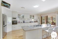 5 Wedgetail Drive Kew NSW 2439 $1,095,000 Embark on a delightful journey of homely grandeur with this magnificent property situated at 5 Wedgetail Drive, Kew. This impressive residence is perfectly tailored for a diverse cohort of potential homeowners, from upsizers to downsizers, growing families to early retirees, and savvy investors seeking a sterling addition to their portfolios. Boasting four generously proportioned bedrooms and two well-appointed bathrooms, this house is presented in immaculate condition, ready to welcome you to a life of comfort and style. The main bedroom serves as a sanctuary, complete with a walk-in robe, an ensuite, and a dressing nook, ensuring privacy and elegance. The heart of this home is the stunning open-plan kitchen, brimming with modern appliances and a welcoming ambiance, making it an ideal space for culinary exploration. Adjacent to it, the formal living room provides a tranquil retreat from the hustle and bustle, while the flowing dining and family room extend seamlessly to an outdoor entertaining area, offering breathtaking views of the serene North Brother Mountain. The expansive 762sqm land allotment is complemented by a sunny front porch where one can indulge in leisurely moments as the world gently passes by. With two parking spaces and executive oversized living spaces, this property is as practical as it is enchanting. Convenience is key, with the residence located a mere 450 metres from the Woolworths Shopping Complex, 1.5km from the nearest boat ramp into Queens Lake, a brief 7-minute drive to Laurieton, and just 25 minutes to the bustling heart of the regional hub of Port Macquarie. 5 Wedgetail Drive is more than a house; it's a haven of peace, convenience, and luxury. Seize this opportunity to craft your own slice of paradise.