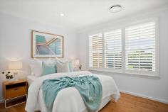 76 Waratah Street Windang NSW 2528 $1,290,000 A dream home that anyone would be lucky to call their own, this beautifully presented four-bedroom property is proudly set on a level block in a quiet, family-friendly location. With a timeless canvas, complemented by tasteful plantation shutters, ducted air conditioning and floorboards throughout this light-filled residence offers an oversized gourmet kitchen with ample storage, a fridge drawer and a duo oven with inbuilt grill. The main bedroom is a true sanctuary, boasting a walk-in wardrobe and a recently renovated ensuite, while the recessed lounge room and separate dining area create an inviting setting for effortless family living and entertaining. Step outside and discover a fully fenced, low-maintenance backyard with a seamless mix of decking and grass, designed for both relaxation and connection with endless opportunities to maximise every square inch of space. Adding to the appeal, the tandem garage offers secure parking for two vehicles with enough room leftover for bikes, tools, or weekend adventure gear. level block, tandem garage main bedroom with WIR, ensuite plantation shutters, ducted a/c recently renovated bathrooms cosy backyard, internal laundry