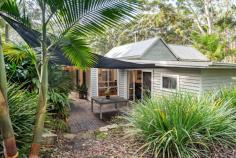 52-54 Parkes Street Helensburgh NSW 2508 $1,200,000 Welcome to 52-54 Parkes Street, Helensburgh - a delightful family home offering serene bush views. This inviting three bedroom residence features a master suite with a chic ensuite, and glass sliding doors that open onto a spacious deck, the perfect spot to enjoy your morning coffee. All three bedrooms offer built in robes and there is a bonus dressing room/home office off the master. The sun-drenched living area and dining area highlights the peaceful surroundings, and the stunning kitchen serves as the heart of the home, boasting an island bench, ample storage and generous bench space. Reverse cycle airconditioning and combustion fireplace ensures year round comfort. Set on a 1008m² block, the property includes tiered gardens with a variety of native trees and a lush lawn, adding to its charm. Relax on the deck, ideal for entertaining, and take in the views of the adjacent bushland, which is designated environmental land, ensuring your privacy. The home also features a single car garage, off street parking and is conveniently located within walking distance to schools, shops, and the railway station. This beautiful home is ready for you to move in and enjoy. A visit is a must to fully appreciate all it has to offer. Three bedrooms all with built in robes Modern family bathroom and chic ensuite Glass doors from both the master bedroom and living area to alfresco deck Stunning kitchen with island bench and ample storage and bench space Polished floorboards throughout living areas Airconditioning and combustion fireplace for year round comfort 1011.7 m2 parcel of land with tranquil bush outlook Walking distance to local schools and train station