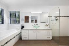 32 Dungogie Drive Tallebudgera QLD 4228 $2,895,000 If you're seeking space, serenity and style within a tranquil, tree-lined setting, this is the residence you've been waiting for! Set well back from the street on a 4,991m2 block, it's designed for effortless living and entertaining. Sprawling across a light-filled floorplan, timber floors bring warmth to the sophisticated interiors, which includes a sleek kitchen with a waterfall-edge stone island and abundant storage. Anchoring the open plan family zone, it spills onto an expansive alfresco deck via bifold doors, while a lounge with a cosy fireplace gazes upon poolside views. Elegance and space also intertwine in the master suite, boasting exterior access, an oversized ensuite, and skylit walk-in robe. Three additional bedrooms with built-in robes are serviced by a tasteful main bathroom, creating a functional layout that supports growing families. Outside, the expansive alfresco deck will be a popular place to congregate. Capturing a lush and leafy outlook, it's an ideal sanctuary for relaxing or hosting guests. There's ample room to roam outdoors too, with a landscape of towering trees and established gardens punctuating the usable land. And after the adventures are done, cool off in the saltwater pool. Additionally, parking is plentiful, thanks to a triple garage and a powered 9m x 7m shed that features a handy workshop and 2m covered patio. Tucked away in the tightly held "'Tallebudgera Park"' Estate, take advantage of a semi-rural lifestyle that doesn't compromise on proximity to conveniences. Local shops, services and Tallebudgera State School await in approx. 2 minutes by car, and you can feel the sand beneath your feet at Palm Beach or Burleigh in approx. 11 minutes. Don't miss the chance to secure a peaceful property that promises contemporary comfort. Arrange an inspection today. House Features: Sophisticated family oasis within a tree-lined, tranquil paradise Sleek and stylish interiors warmed with timber floors Modern kitchen with waterfall-edge stone island bench, large double sink with stainless steel tapware, dual dishwasher drawers, gas cooktop and ample storage Family room adjoins kitchen, seamlessly flows onto the alfresco deck via bifold doors Separate dining zone with stunning pendant lighting Lounge room with cosy fireplace and pool views Spacious master suite includes external access, an oversized ensuite with bath, rain shower head plus a walk-in robe with skylight Bedrooms 2, 3 and 4 with built-in robes Main bathroom features a large shower, vanity, and separate toilet Expansive alfresco entertaining deck enjoys a lush and leafy outlook Saltwater pool overlooks a canopy of natural greenery Triple garage with 15 amp plug and workshop/multipurpose area Laundry with stone benches, sink, storage and outdoor access Split system air-conditioning units and ceiling fans Crimsafe screens throughout Property Features: 4991m2 block comprising vast usable land, towering trees and established gardens Set well back from the street for enhanced peace and privacy Accessed via a long driveway 9m x 7m work shed with 2m wide covered patio, workshop, 3 phase power and room to park another two cars 3m x 3m garden shed Lockable pool pumphouse Outdoor sensor lighting 5,000 gallon Water Tank Location: Approx. 2 mins to Tallebudgera State School and shops Approx. 5 mins to St. Andrew's Lutheran College Approx. 11 mins to Burleigh Heads Approx. 11 mins to Palm Beach Approx. 14 mins to Currumbin Beach Approx. 19 mins to Gold Coast Airport Approx. 31 mins to Surfers Paradise