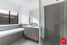 19 Namatjira Boulevard Huntly VIC 3551 $575,000 - $620,000 Boasting space, style and functionality, this contemporary four-bedroom residence presents an ideal opportunity for families or investors seeking a move-in ready home in a peaceful Huntly location. Positioned in a family-friendly neighbourhood and finished to a high standard, 19 Namatjira Boulevard is perfectly suited for modern living. The home welcomes you with a wide foyer entrance and a flexible floor plan designed to accommodate growing households. At the heart of the home is an expansive open-plan living and dining zone, complemented by a sleek kitchen featuring stainless steel appliances, a large island bench, walk-in pantry, and ample cabinetry. A second, separate sitting room offers additional space for formal lounging, a home theatre, or children's retreat. The master bedroom is positioned at the front of the home for privacy and features a generous walk-in robe and stylish ensuite. The remaining three bedrooms-each with built-in robes-are serviced by a central bathroom with bath, separate shower, and separate toilet, ideal for family convenience. Additional highlights include a spacious laundry with external access, ducted heating and cooling, double remote garage with internal entry, and low-maintenance front and rear yards ready for landscaping or play. Located just minutes from local schools, shops, Huntly Recreation Reserve and only 15 minutes from the Bendigo CBD, this quality-built home offers lifestyle, comfort, and long-term appeal. Key Features: • Four spacious bedrooms including master with ensuite and walk-in robe • Expansive open-plan living plus separate second lounge • Modern kitchen with 900mm oven, walk-in pantry and island bench • Double remote garage with internal access; ducted heating and cooling throughout
