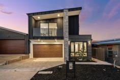 44 Robin Boyd Crescent TAYLOR ACT 2913 $1,100,000 Surrounded by nature reserves and nestled in the growing suburb of Taylor, this sophisticated 'as new' home has a lot to offer a large family. Its functional, modern design ensures low maintenance living, and its proximity to schools, shops and Canberra CBD, means less time commuting and more time relaxing. Built for comfort, style and functionality, neutral tones, timber look floors and thoughtful modern lighting provide a warming ambiance throughout this home. There is an open plan living and dining room and central executive style kitchen, which features stunning marble glass splash back, stone bench, exquisite fittings, sleek cabinetry, stainless steel oven, induction cooktop, and a walk-in butler's pantry. All season entertaining is invited in the formal lounge with an elegant electric gas fireplace and a covered outdoor alfresco terrace with servery, sink and barbecue. Also on the lower level is a third guest bathroom, fourth bedroom with robe, and laundry with external access. Upstairs, there are two more generous sized bedrooms with robes, a stylish family bathroom with separate shower, edgeless tub and WC, and an additional sitting room perfect for a children's retreat, studying or reading nook. The master suite is a haven offering built in cabinetry with a stone bench, walk-in robe, private balcony and luxurious ensuite complete with large shower, twin sinks, LED lighted mirrors and heated towel rack. Functional features of the home include air-conditioning, ducted heating, ample storage, security system, easy care fenced yard and two car garage with internal access. Taylor offers relaxed weekends perfect for family living. Explore nearby nature reserves, get active at Taylors adventure playground, discover local bike tracks or simply chill at home in one of the many spacious living zones. Conveniently located, this home is minutes to local schools, Amaroo Village Shopping Centre, Gungahlin town centre and Casey Market Town, and there is plenty of public transport on the doorstep including light rail to the CBD. Taylor is a growing suburb with several developments in the works including a government high school, two sporting fields and additional shops. Be quick to view this incredible family home in a family friendly community. Features - 'As new' modern family home in convenient location Bright open plan kitchen, living and dining room Executive style kitchen and walk in butler's pantry Formal lounge with contemporary electric fireplace Alfresco entertaining area with sink and servery Three robed bedrooms and stylish family bathroom Master suite with luxurious ensuite and walk in robe Balcony from master suite and upstairs sitting room Additional downstairs bathroom and large laundry Air-conditioning, ducted heating and ample storage Fully fenced, easy care backyard in quiet leafy street Two car garage with internal access, security system Close to local schools, shops, parks, nature reserves Minutes to Gungahlin town centre, 25 minutes to CBD