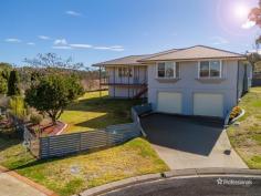 87 Ash Tree Drive Armidale NSW 2350 $850,000 Welcome to 87 Ash Tree Drive, a beautifully renovated family home nestled at the end of a peaceful cul-de-sac in one of Armidale’s most sought-after neighborhoods. This spacious property, set on a generous 959-square-meter block, offers a perfect balance of modern updates and expansive indoor-outdoor living spaces. Upon entry, the ground level boasts a secure double lock-up garage with internal access, providing convenience and peace of mind. Inside, you’ll find three well-sized bedrooms, each fitted with built-in sliding wardrobes, and a home office that can easily serve as a fourth bedroom. The master suite, complete with a private ensuite, ensures a restful retreat for the heads of the household. The open-plan living and dining area, updated with elegant neutral tones and low-maintenance timber-style flooring, offers ample room for family gatherings. Large windows flood the space with natural light and provide panoramic views of the surrounding scenery. The modern kitchen is a chef’s delight, featuring a dishwasher, double fridge space, breakfast bar, and plenty of bench space to make meal prep a breeze. Comfort is key in this home, with ducted reverse-cycle air conditioning throughout to keep you cozy year-round. Outside, the charm continues with an undercover patio area perfect for alfresco dining, complemented by views of bushland and no rear neighbors. A solar system is already in place, adding efficiency to this immaculate home.