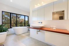 16 / 463 Trees Road Tallebudgera QLD 4228 $1,795,000 Immersed within a lush and leafy natural canopy, this award-winning home is a truly tranquil Tallebudgera oasis. Part of an exclusive gated estate and sprawled across a 3391m2 block, it's serene, sophisticated and spacious – with the added allure of fully self-contained dual living. Designed with a strong connection to the lush landscape, you'll feel instantly at one with nature. From the vast decking that embraces the entire residence to the expansive use of glazing throughout, the greenery is only ever a glance away. Just as impressive is the seamless flow between the open-plan kitchen, living, and dining area and outdoors. After you've cook up a feast with premium appliances, large scale slider doors lead onto the wraparound deck, creating a perfect place for family meals, entertaining friends or simply savouring the serenity. Three bedrooms and two stylish bathrooms also grace the top floor. In the master suite, gaze out at the bushland beauty from the cosy sitting area or contemporary ensuite, soaking away the day in the freestanding bath. Downstairs expertly caters to multi-generational living or an additional revenue stream to offset your mortgage. Privately accessed, the stylish dual living area boasts a kitchen with gas cooking, living/dining area, bedroom with a walk-in robe and combined bathroom/laundry and opens to a spacious alfresco deck. Situated in an exclusive gated estate, take advantage of being a short drive from shops, cafes and schools, and just 15 minutes from the sand and surf of Currumbin. Vibrant Burleigh, where you can indulge in local beaches, restaurants and boutique shopping, is 16 minutes from home, with frequent flyers able to access Gold Coast Airport in 20 minutes (approx.). Harmonising space, style, and serenity, you won't want to miss this one – arrange your inspection today! House Features: Serene, sophisticated and spacious award-winning residence immersed within a lush bushland canopy Spans two levels, designed for fully self-contained dual living Vast decking wraps around the whole home, capturing mesmerising bushland vistas Elegant and expansive open plan kitchen, living and dining zone with a seamless connection to the outdoors Stylish kitchen with a waterfall-edge stone island bench, gas cooktop, Miele dishwasher Master suite with cosy sitting area, walk-in robe and a modern ensuite with floating vanity, large triple shower, concealed cistern toilet and freestanding bath gazing out at the greenery Bedroom with a built-in robe and external access Bedroom with lockable storage plus a built-in robe and desk Main bathroom features a shower, vanity and toilet Ceiling fans and air-conditioning Large workshop/storeroom Laundry Spacious 4-car carport Dual Living Features: Privately accessed Kitchen with gas cooktop Light, bright living/dining zone Bedroom with walk-in robe Combined bathroom/laundry Spacious wraparound alfresco deck Property Features: Secluded, lush and leafy 3391m2 block in a gated estate Former HIA Best Housing winner for the “Best Use of Steel” Fire hydrant 30,000L water tank Location: Approx. 5 mins to Tallebudgera State School and shops Approx. 7 mins to St. Andrew's Lutheran College Approx. 7 mins to Coplicks Tallebudgera Golf Course Approx. 8 mins to Meadow Park Golf Course Approx. 8 mins to Tally Valley Golf Course Approx. 11 mins to The Pines, Elanora Approx. 14 mins to Palm Beach Approx. 15 mins to Currumbin Beach Approx. 16 mins to Burleigh Heads Approx. 20 mins to Gold Coast Airport Approx. 28 mins to Kingscliff Beach Approx. 33 mins to Surfers Paradise