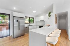 35 Sheridan Crescent Stanwell Park NSW 2508 Positioned on a quiet street in the peaceful village of Stanwell Park, this partially renovated family home provides you with everything you could want from coastal living. YOUR HOME • The house has undergone some recent renovations with the floorplan opened up, fresh carpet and painting, along with a new kitchen with stone benchtops. You can move in and live comfortably or continue the renovations through the rest of the home to add your own style and taste. • On the lower level of the home you will find a large rumpus room with fireplace. It's ideal for use as a kids play area, hobby room, art studio or 4th bedroom as the adjacent laundry doubles as a full bathroom. • Every square metre of the property has been cleverly utilised. The front yard is terraced, grassed and fenced, providing additional yard space. The rear is much the same with a spacious entertaining deck overlooked by another private yard space with ocean views, an ideal area to retreat to the firepit after enjoying lunch/dinner with family and friends. • As the home is elevated on the high side of the street, you are provided with ample peace, privacy and views of the surrounding mountain as well as the ocean. • The front entertaining deck overlooks your grassed yard, allowing you to watch the children play while you prepare dinner or entertain friends. • Other features include a secure double garage with internal access, outdoor shower complete with hot water for when you get back from the beach, reverse cycle aircon to keep you comfortable year-round, built-in wardrobes in all upstairs bedrooms as well as quality security cameras at the front and rear for additional peace of mind. LOCATION • One of Stanwell Park's most family friendly streets, being a quiet cul de sac with very little traffic and plenty of friendly long term residents. • Only a moment's stroll to the pristine Stanwell Park beach which is fully patrolled, offers fantastic surf breaks and is dog friendly. • You can leave the car at home as the local cafes, school, shops and restaurants are all only minutes from your front door. • The Royal National Park is situated just 10 minutes drive. • Stanwell Park is located approximately 1 hour South of Sydney CBD and approximately 30 minutes North of Wollongong CBD. • Embrace the quintessential coastal lifestyle and all that comes with it... swimming, fishing, bushwalking, hang gliding and family picnics in popular parklands all available only moments from your doorstep.