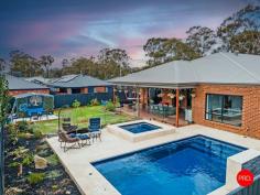 31 Harveys Lane Jackass Flat VIC 3556 $870,000 - $950,000 Perfectly positioned in a quiet, family-friendly pocket just moments from Bendigo's CBD and within walking distance to Neangar Golf Club, this immaculately presented five-bedroom home delivers the ideal blend of modern comfort, space, and lifestyle appeal. From the moment you step inside, the home radiates warmth and quality. At its heart is a light-filled open-plan kitchen, living, and dining area where natural light floods through large windows, creating an inviting space for everyday living. The stylish, modern kitchen is a standout with its sleek design, quality appliances, and generous bench space - ideal for home cooks and entertainers alike. Designed for growing families, this home offers multiple living zones, including a dedicated theatre room for movie nights and a huge separate study perfect for working from home or managing a busy household. Each of the five spacious bedrooms features a walk-in robe, while the master suite is a private retreat complete with its own ensuite and large walk-in wardrobe. Step outside and you'll find the ultimate family haven. A stunning undercover alfresco area overlooks a sparkling in-ground pool with an inbuilt spa, alongside a large lawn for the kids to enjoy. A full-size basketball court adds to the entertainment options, making this backyard one the whole family will love. With the addition of a small shed and wide side access, there's plenty of space to store a caravan or trailer with ease. This exceptional home has been thoughtfully designed to cater to every stage of family life, offering a rare combination of space, style and functionality in a highly sought-after location.