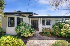 20 Bartoman Street Batlow NSW 2730 $780,000 Positioned on a generous double corner allotment in the heart of the picturesque town of Batlow, sits this extremely well-maintained Californian style Bungalow beauty. Boasting three great sized bedrooms, two bathrooms and multiple indoor and outdoor entertaining areas, the home oozes charm and character throughout, with a touch of modern comforts and design, this grand old dame offers diverse living and entertaining options all year round. A unique opportunity in the heart of Batlow, this character filled gem is sure to not last long. Call today to book your inspection. Premiere Features: - Three great sized bedrooms, all with ceiling fans and the master boasting two bay windows looking out over the grounds - Main bathroom with separate stand-alone bath, separate shower, single vanity and toilet - Sun-filtered kitchen with gas cooktop and combustion stove, pressed metal ceilings, large walk-in pantry and traditional style casements windows with pass ability to outdoor entertaining - Centrally located dining in the heart of the home with split system air conditioning - Large formal lounge with wood box fire heater and split system air conditioning - Mudroom positioned to rear access - Great sized study nook - Secondary formal lounge with gas heating and ceiling fan, complimented by sun filtering plantation shutters and direct access to the deck - Large fully covered wrap around deck with an elevated aspect overlooking the rear yard and sprawling hills - Internal laundry - Second separate toilet and shower privately positioned to the rear of the plan - Large semi-formal grounds with mature landscaping throughout - Additional quaint deck, perfectly positioned for the afternoon sun - Corner allotment with dual street vehicle access - Single lock up garage and workshop space - Ample off street parking options, plenty of space for the caravan or boat - Additional garden shed positioned to the rear of the allotment and fully fenced for those four-legged friends Additional Features: - High ceilings with ornate cornicing - Large traditional bay windows - Sash and casement windows - Polished timber flooring - Oversized formal entry - Gas hot water and heating option - The home has been fully rewired