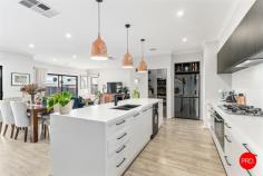 31 Harveys Lane Jackass Flat VIC 3556 $870,000 - $950,000 Perfectly positioned in a quiet, family-friendly pocket just moments from Bendigo's CBD and within walking distance to Neangar Golf Club, this immaculately presented five-bedroom home delivers the ideal blend of modern comfort, space, and lifestyle appeal. From the moment you step inside, the home radiates warmth and quality. At its heart is a light-filled open-plan kitchen, living, and dining area where natural light floods through large windows, creating an inviting space for everyday living. The stylish, modern kitchen is a standout with its sleek design, quality appliances, and generous bench space - ideal for home cooks and entertainers alike. Designed for growing families, this home offers multiple living zones, including a dedicated theatre room for movie nights and a huge separate study perfect for working from home or managing a busy household. Each of the five spacious bedrooms features a walk-in robe, while the master suite is a private retreat complete with its own ensuite and large walk-in wardrobe. Step outside and you'll find the ultimate family haven. A stunning undercover alfresco area overlooks a sparkling in-ground pool with an inbuilt spa, alongside a large lawn for the kids to enjoy. A full-size basketball court adds to the entertainment options, making this backyard one the whole family will love. With the addition of a small shed and wide side access, there's plenty of space to store a caravan or trailer with ease. This exceptional home has been thoughtfully designed to cater to every stage of family life, offering a rare combination of space, style and functionality in a highly sought-after location.