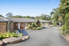 6 Green Lane Tallebudgera QLD 4228 $2,395,000 Backing onto lush parklands and cocooned in privacy, enjoy peaceful, acreage-style living that doesn't compromise on proximity to amenities. Occupying a 5947m² block and set well back from the street, it's a haven where children can roam freely, families can reconnect, and life takes on a beautiful simplicity. Set across a single level and with fresh, light-filled interiors, the oversized kitchen with a stone island bench, gas cooking and a butler's pantry caters to everyday functionality and entertaining. In the adjoining open-plan living and dining zone, a stone-clad fireplace creates a cosy atmosphere on chilly winter nights, plus enjoy the comfort and charm of the four bedrooms. Led by a master suite with built-in and walk-in robes, it's complemented by a sleek ensuite bathed in natural light, while the main family bathroom includes a spa and separate toilet. Outdoors, the expansive alfresco deck invites everything from large-scale celebrations to relaxed weekend brunches with friends. Steps away, a freeform saltwater pool offers refreshment, with tropical gardens that add a holiday-at-home feel. The flat, usable land offers exceptional versatility too, ideal for active kids or to even accommodate a horse. Then, as the sun sets, gather around the open-air firepit for toasts and tales under the stars. And for those seeking a taste of sustainability, established mango, lime, lemon, mandarin, macadamia and lemonade trees accompany a flourishing herb garden and active beehives. Additionally, a 5kW solar system adds to its eco credentials, plus take advantage of an abundance of outdoor storage, with three substantially-sized sheds handy for a tradesperson, car enthusiast or workshop. Situated in a quiet cul-de-sac, the best of both worlds beckons. Embrace peace and privacy without compromising on your proximity to Tallebudgera State School, local shops, and parks. You can even stroll to Meadow Park Golf Course for a leisurely nine holes! Popular Burleigh and Palm Beach are ready to tempt you in approx. 10 minutes, along with an array of delicious coastal cafes and restaurants. Inspect now to experience the tranquillity and create a lifestyle grounded in space and serenity. House Features: Private and peaceful single level home, set back from the street and backing onto parklands Oversized kitchen features waterfall-edge stone island bench, gas stovetop and a butler's pantry Open-plan living and dining zone adjoins the kitchen, with a charming stone-clad fireplace Master suite opens to the deck, includes built-in and walk-in robes plus a modern ensuite with stone double vanity Three additional bedrooms with built-in robes Main bathroom includes spa, rainfall shower, vanity and separate toilet Expansive alfresco entertaining deck – can accommodate up to 100 guests Freeform salt chlorinated pool bordered by a sun deck and tropical greenery Large, level backyard with usable land, perfect for a horse Open-air firepit Double garage Laundry includes stone bench, ample storage, and external access Ample storage throughout Ducted Air Conditioning Property Features: 5947m2 block with usable land 12m x 7m, 9m x 7.8m and 3m x 5.9m shed; one with parking for 4 cars, air-conditioning and multipurpose room and one with high clearance, mezzanine storage and 3.5 tonne 2 post car hoist Established mango, macadamia, lemonade, lime, mandarin, and lemon trees Herb garden with rosemary and lemongrass Active beehives 5kW solar system Location: Approx. 1 min drive to Tallebudgera State School, Man on the Bike shops and services Approx. 1 min walk to Valley Drive Park Approx. 2 min walk to Meadow Park Golf Course Approx. 4 min drive to St. Andrew's Lutheran College Approx. 10 min drive to Burleigh Heads Approx. 10 min drive to Palm Beach Approx. 14 min drive to Currumbin Beach Approx. 18 min drive to Gold Coast Airport