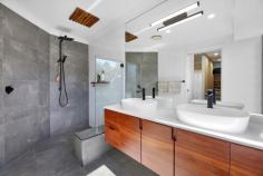 6 Green Lane Tallebudgera QLD 4228 $2,395,000 Backing onto lush parklands and cocooned in privacy, enjoy peaceful, acreage-style living that doesn't compromise on proximity to amenities. Occupying a 5947m² block and set well back from the street, it's a haven where children can roam freely, families can reconnect, and life takes on a beautiful simplicity. Set across a single level and with fresh, light-filled interiors, the oversized kitchen with a stone island bench, gas cooking and a butler's pantry caters to everyday functionality and entertaining. In the adjoining open-plan living and dining zone, a stone-clad fireplace creates a cosy atmosphere on chilly winter nights, plus enjoy the comfort and charm of the four bedrooms. Led by a master suite with built-in and walk-in robes, it's complemented by a sleek ensuite bathed in natural light, while the main family bathroom includes a spa and separate toilet. Outdoors, the expansive alfresco deck invites everything from large-scale celebrations to relaxed weekend brunches with friends. Steps away, a freeform saltwater pool offers refreshment, with tropical gardens that add a holiday-at-home feel. The flat, usable land offers exceptional versatility too, ideal for active kids or to even accommodate a horse. Then, as the sun sets, gather around the open-air firepit for toasts and tales under the stars. And for those seeking a taste of sustainability, established mango, lime, lemon, mandarin, macadamia and lemonade trees accompany a flourishing herb garden and active beehives. Additionally, a 5kW solar system adds to its eco credentials, plus take advantage of an abundance of outdoor storage, with three substantially-sized sheds handy for a tradesperson, car enthusiast or workshop. Situated in a quiet cul-de-sac, the best of both worlds beckons. Embrace peace and privacy without compromising on your proximity to Tallebudgera State School, local shops, and parks. You can even stroll to Meadow Park Golf Course for a leisurely nine holes! Popular Burleigh and Palm Beach are ready to tempt you in approx. 10 minutes, along with an array of delicious coastal cafes and restaurants. Inspect now to experience the tranquillity and create a lifestyle grounded in space and serenity. House Features: Private and peaceful single level home, set back from the street and backing onto parklands Oversized kitchen features waterfall-edge stone island bench, gas stovetop and a butler's pantry Open-plan living and dining zone adjoins the kitchen, with a charming stone-clad fireplace Master suite opens to the deck, includes built-in and walk-in robes plus a modern ensuite with stone double vanity Three additional bedrooms with built-in robes Main bathroom includes spa, rainfall shower, vanity and separate toilet Expansive alfresco entertaining deck – can accommodate up to 100 guests Freeform salt chlorinated pool bordered by a sun deck and tropical greenery Large, level backyard with usable land, perfect for a horse Open-air firepit Double garage Laundry includes stone bench, ample storage, and external access Ample storage throughout Ducted Air Conditioning Property Features: 5947m2 block with usable land 12m x 7m, 9m x 7.8m and 3m x 5.9m shed; one with parking for 4 cars, air-conditioning and multipurpose room and one with high clearance, mezzanine storage and 3.5 tonne 2 post car hoist Established mango, macadamia, lemonade, lime, mandarin, and lemon trees Herb garden with rosemary and lemongrass Active beehives 5kW solar system Location: Approx. 1 min drive to Tallebudgera State School, Man on the Bike shops and services Approx. 1 min walk to Valley Drive Park Approx. 2 min walk to Meadow Park Golf Course Approx. 4 min drive to St. Andrew's Lutheran College Approx. 10 min drive to Burleigh Heads Approx. 10 min drive to Palm Beach Approx. 14 min drive to Currumbin Beach Approx. 18 min drive to Gold Coast Airport