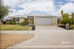 60 Helmsley Pkwy Alkimos WA 6038 $829,000 Beautifully finished with stylish upgrades throughout, this exceptional 4×2 home impresses from the moment you arrive! Boasting an abundance of space and a cleverly designed floorplan to suit every stage of family life, it’s the perfect property for growing families. Don’t delay as this home is sure to get the attention it deserves. Call now to submit your offer! Instantly captivating with its modern façade, this spacious family residence stands proudly on a 540sqm block, boasting an impressive 229sqm of internal living! Perfectly positioned within walking distance to Alkimos Primary School & College, Trinity Village shopping centre and surrounded by family-friendly parks, this home combines convenience with style. With the Alkimos train station now open and the Romeo Road Freeway access nearby, city commutes have never been easier. Built with the growing family in mind, every detail of this home has been carefully considered. The rendered feature entrance and manicured gardens create a striking first impression, setting the tone for the sophistication that awaits inside. Step through the oversized front door and be welcomed by wide hallways, warm wooden flooring and a breezy coastal-inspired colour palette. Designed and crafted by Red Ink Homes, the spacious property is filled with thoughtful touches and quality finishes throughout. Nicely secluded at the front of the home, the king-sized master suite is a true retreat, boasting soft sumptuous carpets, ambient lighting, beautiful décor, ‘his & hers’ walk-in robes and an open ensuite complete with stone benchtops, oversized shower, separate W/C and premium fixtures & fittings. All three minor bedrooms are generously sized, each complete with built-in robes and neutral decor. Children or guests will love having their own private wing, offering comfort and independence. This zone is complemented by a spacious activity room – perfect for gaming, homework, or relaxing with friends. The family bathroom mirrors the master ensuite with sleek stone benchtops and contemporary fixtures, adding a touch of luxury. A separate powder room adds to the convenience. At the heart of the residence, the huge deluxe kitchen really steals the show! Designed to delight even the most discerning chef, it features ‘Essa’ stone benchtops, stainless steel appliances, dishwasher, double fridge recess and masses of soft closing cupboards and bench space. A chic pendant-lit breakfast bar and window splashback underscores the high-end finish. A built-in coffee nook completes the space – your daily caffeine ritual just got an upgrade! The expansive dining and living area make this open plan hub perfect for entertaining or quiet nights in. When it’s time to unwind the private theatre room, with plush carpets and dark tones, delivers a cinematic escape that will delight guests and keep teens happily entertained for hours on end. A separate dedicated study provides the ideal work-from-home setup or a quiet retreat for students to focus and thrive. Outdoors, the extended alfresco has been tailored for year-round enjoyment with a built-in BBQ, garden planters and a relaxed atmosphere that’s ideal for social gatherings. There’s plenty of lawn for children and pets, plus three veggie patches for those with a passion for homegrown produce! Spacious, stylish and versatile, this extra-large home is the perfect blend of luxury and practicality, designed for modern family living at its finest. EXTRAS INCLUDE: Double garage (heightened + widened) + loft space with flooring, separate laundry + line, ducted reverse cycle air conditioning, solar panels (6Kw inverter) + solar boosted gas HWS, additional TV + data points, LED lighting, reticulation, clothesline, and so much more! Specifics: Year Built: 2014 Builder: Red Ink Homes Land Area: 540sqm Living Area: 229sqm Council/Land Rates: Approx $2900 per annum Water Rates: Approx. $1900 per annum Rental return: Approx. $750 – $775 per week