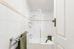 6 Waterhouse Rd South Plympton SA 5038 $875,000 to $910,000 From its classic façade complete with picket fence to gorgeous upgrades throughout, this 1925-built Bungalow maisonette is character meets contemporary in the very best way. Polished timber floorboards, original fretwork and sky-high ceilings line the entry, where both bedrooms are easily accessible, the master offering mirrored robes and a northerly-aspect outlook via big windows to the front yard. Upgraded with full-height tiling, shower over bath and pedestal vanity, the bathroom is just down the hall, with convenient separate toilet. Centrally positioned, a cosy formal lounge room enjoys a ceiling fan, split system air conditioner and ornamental open fireplace with mantle. Open, airy and renovated, the modern kitchen and meals space will delight cooks of the home with a gas cooktop, glass splashback, dishwasher, twin-door pantry, plenty of storage and a breakfast bar. Colonial-style French doors open onto a brilliant rear alfresco space, where a curved roof pergola with ceiling fan adds protection while still allowing natural light, and the outdoor kitchen with gas connection is ready for making year-round entertaining a piece of cake, all with the established and easy-care rear garden as your backdrop. More you'll adore: - Separate renovated laundry - Timber venetian blinds - Ceiling fan + ornamental fireplace to bedroom 2 - Remote lockable carport + off-street parking with drive-through access to rear garage - Raised garden beds with westerly aspect along driveway - Ducted evaporative cooling + gas heating - Close proximity to Emmaus Christian College You'll love the location, where local shops, cafes and hotels, bus and train transport, The Crescent Reserve and Edwardstown Oval are all within walking distance, and Castle Plaza Shopping Centre is just a few minutes' drive. Close to CBD and the sea and presented to perfection, this one will have a high appeal; come and check it out for yourself.