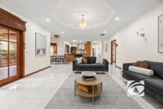 4 Livingstone Rise Lynbrook VIC 3975 $1,100,000 - $1,200,000 Every Child Gets Their Own Castle: Spacious Family Haven Discover the pinnacle of family living at 4 Livingston Rise, where this magnificent 40-square custom-built home sits in prestigious Lynbrook Heights, surrounded by pristine parklands on an exceptional 684 sqm (approx.) sanctuary. This is your family's gateway to Melbourne's most desirable family-focused community, where children thrive and parents enjoy unparalleled convenience. The thoughtfully designed residence welcomes you through an impressive foyer to the spacious master bedroom with bay window, walk-in robe, and private ensuite. The heart of the home flows seamlessly from generous family and dining areas into a fully enclosed alfresco space and expansive rumpus room, perfect for growing families. The gourmet kitchen, featuring granite benchtops, timber cabinetry, 900mm gas cooking, and walk-in pantry, becomes the natural gathering point, with a convenient second kitchen in the garage for effortless entertaining. Six generous bedrooms with built-in robes ensure everyone has their own personal retreat, complemented by family bathroom, powder room, and separate toilet. Year-round comfort comes through central heating, evaporative cooling, and quality window furnishings, while the double lock-up garage and garden shed provide practical storage. The location delivers true family magic. Lynbrook Heights positions you moments from excellent state and Catholic primary schools, with Lynbrook Shopping Centre's Coles, medical centre, and diverse dining just minutes away. Lynbrook Station provides seamless Melbourne CBD connectivity, creating perfect work-life balance. Children flourish with numerous parks, playgrounds, and the strong community spirit that makes neighbors lifelong friends. Ready to create your family's story? Don't let this opportunity pass by. Contact us today to arrange your private inspection and experience why Lynbrook Heights families never want to leave.