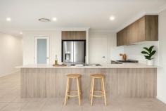 22 Tomerong Street Tullimbar NSW 2527 $1,280,000 - $1,330,000 Welcome to 22 Tomerong Street, Tullimbar - a spacious family haven designed for relaxed living, effortless entertaining and breathtaking escarpment views. Positioned on a level 497m² block, this impressive residence offers 5 oversized bedrooms, including a versatile ground-floor guest suite ideal for multi-generational living or visiting guests. With 3 modern bathrooms and multiple expansive living areas, there's plenty of room for the whole family to relax, play and entertain. At the heart of the home is the stylish kitchen, thoughtfully designed to capture uninterrupted views of the escarpment. Complete with a walk-in pantry, 900mm oven, and 5-burner gas cooktop, it's the perfect setting to prepare meals or host gatherings while soaking in the incredible outlook. Outside is a backyard oasis, where an outdoor spa and a large covered alfresco area set the scene for ultimate relaxation and effortless entertaining. The yard offers plenty of space for children and pets to play, all while enjoying the stunning escarpment backdrop. Whether it's unwinding after a busy day or sharing summer evenings with loved ones, this outdoor space is truly special. HIGHLIGHTS INCLUDE • 5 generous bedrooms • 3 bathrooms • Spa • Ducted air-conditioning • 6.6kw solar system • Multiple open-plan living areas • Kitchen overlooks the escarpment and has quality inclusions like walk in pantry, 900mm oven, 5 gas burner cooktop • Big driveway ideal for large families with multiple cars • Level 497m2 block with plenty of backyard for kids and pets to play • Peaceful escarpment views