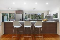 6 Green Lane Tallebudgera QLD 4228 $2,395,000 Backing onto lush parklands and cocooned in privacy, enjoy peaceful, acreage-style living that doesn't compromise on proximity to amenities. Occupying a 5947m² block and set well back from the street, it's a haven where children can roam freely, families can reconnect, and life takes on a beautiful simplicity. Set across a single level and with fresh, light-filled interiors, the oversized kitchen with a stone island bench, gas cooking and a butler's pantry caters to everyday functionality and entertaining. In the adjoining open-plan living and dining zone, a stone-clad fireplace creates a cosy atmosphere on chilly winter nights, plus enjoy the comfort and charm of the four bedrooms. Led by a master suite with built-in and walk-in robes, it's complemented by a sleek ensuite bathed in natural light, while the main family bathroom includes a spa and separate toilet. Outdoors, the expansive alfresco deck invites everything from large-scale celebrations to relaxed weekend brunches with friends. Steps away, a freeform saltwater pool offers refreshment, with tropical gardens that add a holiday-at-home feel. The flat, usable land offers exceptional versatility too, ideal for active kids or to even accommodate a horse. Then, as the sun sets, gather around the open-air firepit for toasts and tales under the stars. And for those seeking a taste of sustainability, established mango, lime, lemon, mandarin, macadamia and lemonade trees accompany a flourishing herb garden and active beehives. Additionally, a 5kW solar system adds to its eco credentials, plus take advantage of an abundance of outdoor storage, with three substantially-sized sheds handy for a tradesperson, car enthusiast or workshop. Situated in a quiet cul-de-sac, the best of both worlds beckons. Embrace peace and privacy without compromising on your proximity to Tallebudgera State School, local shops, and parks. You can even stroll to Meadow Park Golf Course for a leisurely nine holes! Popular Burleigh and Palm Beach are ready to tempt you in approx. 10 minutes, along with an array of delicious coastal cafes and restaurants. Inspect now to experience the tranquillity and create a lifestyle grounded in space and serenity. House Features: Private and peaceful single level home, set back from the street and backing onto parklands Oversized kitchen features waterfall-edge stone island bench, gas stovetop and a butler's pantry Open-plan living and dining zone adjoins the kitchen, with a charming stone-clad fireplace Master suite opens to the deck, includes built-in and walk-in robes plus a modern ensuite with stone double vanity Three additional bedrooms with built-in robes Main bathroom includes spa, rainfall shower, vanity and separate toilet Expansive alfresco entertaining deck – can accommodate up to 100 guests Freeform salt chlorinated pool bordered by a sun deck and tropical greenery Large, level backyard with usable land, perfect for a horse Open-air firepit Double garage Laundry includes stone bench, ample storage, and external access Ample storage throughout Ducted Air Conditioning Property Features: 5947m2 block with usable land 12m x 7m, 9m x 7.8m and 3m x 5.9m shed; one with parking for 4 cars, air-conditioning and multipurpose room and one with high clearance, mezzanine storage and 3.5 tonne 2 post car hoist Established mango, macadamia, lemonade, lime, mandarin, and lemon trees Herb garden with rosemary and lemongrass Active beehives 5kW solar system Location: Approx. 1 min drive to Tallebudgera State School, Man on the Bike shops and services Approx. 1 min walk to Valley Drive Park Approx. 2 min walk to Meadow Park Golf Course Approx. 4 min drive to St. Andrew's Lutheran College Approx. 10 min drive to Burleigh Heads Approx. 10 min drive to Palm Beach Approx. 14 min drive to Currumbin Beach Approx. 18 min drive to Gold Coast Airport
