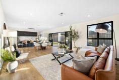 6 Windsor Ave Clovelly Park SA 5042 $1,350,000 - $1,450,000 Spread over two superb levels of unrivalled contemporary living, this Hoppen Group build offers the best of brand new, with plenty of room to move and park views. Its wide clean-lined façade creates a commanding street presence, but it's what's on the inside that counts; a grand front entrance certain to make a fine first impression. Double doors reveal a light-filled open plan heart of the home, where the sleekest of kitchens overlooks dining and living spaces with sliding doors onto an alfresco entertaining space under the main roof. Dark cabinetry adds warmth as well as infinite storage space to the stunning kitchen, where a 5-burner gas cooktop, oven, dishwasher, huge island with breakfast bar and Caesarstone benchtops blend practicality with luxury. Also on the ground floor, a most comfortable bedroom with walk-through robe and spacious ensuite with frameless shower, matte black tapware and accessories and full-height tiling presents an invaluable master option or perfect guest room. Upstairs, a further three bedrooms include another incredible master option; this one flooded with natural north-easterly light, huge walk-through robe and enormous ensuite with dual sink vanity and freestanding bath as well as shower. Bedrooms three and four are serviced by a third bathroom with shower, vanity and toilet. Also on the upper level, a priceless second living space with private balcony overlooking Kensington Reserve ensures plenty of legroom as well as fantastic views and fresh air. We love: - Ducted reverse cycle air conditioning. - Huge laundry lined with full-height hidden storage. - Ground floor powder room. - Double automatic garage with internal access. - Study nook to entry + under stair storage. - Mirrored built-in robes to bedrooms 3 & 4. - Secure low maintenance courtyard. Directly adjacent the Kensington Street Reserve, you'll find the bus, train, Mitchell Park Oval and Clovelly Park Primary School within easy walking distance, with easy access to Westfield Marion, the Tonsley precinct and Flinders University, just 10kms from the CBD and even less to the sea. From its high-quality finishes to its plentiful park views, you'll love calling Windsor Avenue 'home'
