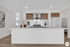 5 Bruhn Street Clyde Morth VIC 3978 $849,000 - $899,000 Beautifully crafted with a focus on comfort and quality, this stunning, brand-new east-facing home offers 25 squares of spacious, thoughtfully designed living. From the moment you step inside, the design reveals itself with a formal lounge - perfect for entertaining or a quiet retreat - before double doors lead you into the grand master suite. This retreat is appointed with His and Hers walk-in robes and a luxurious ensuite featuring a Caesarstone benchtop, freestanding bathtub, dual vanities, oversized shower, and a heated towel rail. A home office/study precedes the true heart of the home - a light-filled open-plan living and dining zone, seamlessly connecting to the undercover alfresco with extended decking. This outdoor haven is ideal for year-round entertaining, with ample space for children and pets. The chef's kitchen showcases Caesarstone benchtops, stone splashback, stainless steel appliances, a 900mm oven with gas cooktop, microwave and dishwasher, plus abundant storage and a walk-in pantry. A large linen cupboard and well-designed laundry add to the home's practicality. The private rear wing includes a second master-size bedroom, two additional bedrooms with built-in robes, a family bathroom with a stunning freestanding bathtub tub and a separate WC. UPGRADED INCLUSIONS • LED lighting - doubled in all rooms and living areas • Additional power points throughout • Double-glazed windows in all living areas and bedrooms • Evaporative cooling & Ducted heating • Blockout roller blinds & flyscreens • Heated towel rail and freestanding bathtub to main bathroom • Double vanity with special order floor-mounted spout and hand shower • 900mm oven & gas cooktop • Microwave oven and dishwasher included • Premium underlay (11mm Dunlop Imperial Plus) for carpet & laminate flooring • 2.7m ceilings and high internal doors LOCATION & LIFESTYLE When good schooling matters, Clyde Grammar is just a short walk away. With low-maintenance landscaping already completed, all that's left is to move in and enjoy.