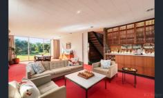 2 Mccolls Way Portsea VIC 3944 $11,000,000 - $12,000,000 Perfectly positioned on the sands of Shelly Beach, this north-facing residence overlooks Port Phillip Bay with spectacular views. Built from concrete and brick in the 1960s, it sits in a quiet cul-de-sac on McColl's Way alongside just two other properties, on 1262sqm of land that opens through a tea-tree canopy directly onto the beach. A wide entrance foyer leads to an open-plan formal lounge and dining room, plus an informal sitting room with adjoining kitchen. Upstairs, five bedrooms and two ensuite bathrooms all open to a generous balcony overlooking the water. Additional features include a carport for two cars and a double lock-up garage.