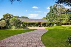 43 Franklin Rd Portsea VIC 3944 $7,950,000 Tranquil, totally private and boasting generous proportions, this magnificent single level residence is set within serene established gardens over a sprawling estate of 3,720m2 approx. Offering excellent family separation with two wings joined by multiple formal and informal living areas all opening out to expansive entertainer’s terrace, inground pool, rolling lawns, trampoline, playground, and championship size north-south tennis court. Ideally positioned within a short stroll of Portsea Pier, Lord Mayor’s Beach, Shelley Beach, Portsea Hotel, fashionable cafes and restaurants, Point Nepean National Park and Percy Cerutty Oval. Welcomed by a sweeping driveway and manicured entrance gardens, featuring wide entrance hall, large formal lounge/dining room with open fireplace, separate bar leading out to terrace, and kitchen/meals informal sitting room opening to terrace and pool. Master bedrooms with ensuite bathrooms and walk in robes in northern and southern wings, three further generously sized bedrooms with built in robes and ensuite bathrooms, all leading out to sprawling gardens, pool, and tennis court. Other features include laundry, large storage throughout, undercover parking for three cars, and off street parking for 2-3 further cars.