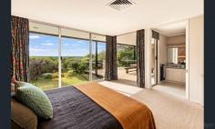 2 Mccolls Way Portsea VIC 3944 $11,000,000 - $12,000,000 Perfectly positioned on the sands of Shelly Beach, this north-facing residence overlooks Port Phillip Bay with spectacular views. Built from concrete and brick in the 1960s, it sits in a quiet cul-de-sac on McColl's Way alongside just two other properties, on 1262sqm of land that opens through a tea-tree canopy directly onto the beach. A wide entrance foyer leads to an open-plan formal lounge and dining room, plus an informal sitting room with adjoining kitchen. Upstairs, five bedrooms and two ensuite bathrooms all open to a generous balcony overlooking the water. Additional features include a carport for two cars and a double lock-up garage.