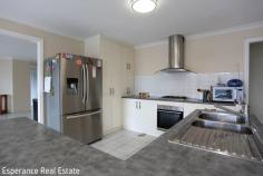 11 Catherine Street Castletown WA 6450 Set in a prime position overlooking the park and playground, this spacious family home offers versatile living and plenty of comfort. Featuring 4 bedrooms plus office, the main suite includes a walk-in robe and ensuite, while the 3 minor bedrooms are fitted with built-in robes and share a central bathroom. A step-down formal lounge and dining welcome you at entry, flowing through to the open plan family, meals and central kitchen – perfect for everyday living and entertaining. Comfort is assured with reverse cycle air conditioning, 2 gas points, security screens, and generous storage throughout. Outdoors, enjoy the undercover patio, garden shed, and double garage under the main roof, completing this well-rounded home.