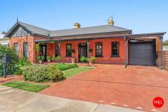 19 Moore Street Rochester VIC 3561 $850,000 - $925,000 Presenting an exceptional fusion of Victorian heritage and modern sophistication, this meticulously renovated five-bedroom residence delivers an inspired lifestyle of comfort, character, and resort-style living on an expansive 692sqm allotment. Step through the elegant entrance hallway adorned with statement chandeliers and decorative archways, where polished timber floors and high ceilings with ornate detailing set an impressive tone. The thoughtful restoration has preserved the home's Victorian charm, including feature exposed brick walls and original fireplaces, while introducing contemporary conveniences throughout. The heart of this home is a spectacular entertainer's kitchen featuring premium appliances, sleek white cabinetry, and striking black subway tile splashback. Open timber shelving adds warmth and character, while the central island with breakfast bar creates a natural gathering point. The thoughtful design seamlessly connects to the dining and family zones, ensuring effortless indoor entertaining. Multiple living areas provide flexibility for modern family life, including a formal living room with elegant bay windows, a generous family room, and a separate dining room. Each space maintains the home's period character with feature fireplaces, while neutral tones and quality carpeting ensure contemporary comfort. The main bedroom suite offers peaceful retreat with generous proportions and direct access to an ensuite, while three additional bedrooms provide excellent accommodation for family or guests. Exposed brick features and decorative fireplaces maintain the home's characterful aesthetic throughout the bedroom wing. The family bathroom showcases quality renovations with large-format white subway tiles, striking patterned floor tiles, and timber vanity with stone benchtop. Gold tapware and fixtures add a touch of luxury, while the separate bathroom and ensuite configuration ensures morning efficiency. The ultimate entertainer's paradise awaits outdoors, where a beautifully appointed in-ground pool takes centre stage. The expansive patio area flows seamlessly from the home, complete with outdoor entertaining zones, while established gardens and mature trees provide privacy and greenery. A covered verandah extends the entertaining options year-round. Significant solar panel installation across the roofline delivers substantial energy savings and environmental benefits, reducing ongoing running costs while supporting sustainable living. Positioned in a sought-after Rochester location with proximity to the Rochester & Elmore District Health Service, this home offers convenient access to local amenities, schools, and community facilities. PROPERTY FEATURES • Four spacious bedrooms with ensuite to main, multiple living zones including formal lounge, family and dining rooms. • Designer kitchen with premium appliances, island bench, exposed brick feature wall and quality finishes throughout • Resort-style in-ground swimming pool with expansive patio, covered verandah and established gardens • Substantial solar panel system, polished timber floors, high decorative ceilings, carport on 692sqm allotment • This is a rare opportunity to secure a meticulously renovated period home where Victorian grandeur harmonizes perfectly with contemporary family living. The addition of resort-style pool facilities, substantial solar installation, and multiple • entertainment zones elevates this property beyond the ordinary, creating a lifestyle of comfort, character, and year-round enjoyment in one of Rochester's most desirable locations.