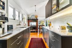 5 Dulhunty Street Katoomba NSW 2780 Step into a piece of history with this charming 1914 weatherboard home, presented to the market for the first time in 85 years. Nestled on a coveted street in South Katoomba, just moments from the escarpment, this property radiates warmth, character, and a profound sense of place - an enduring legacy in one of the Blue Mountains' most treasured locations. The home showcases a versatile floorplan, currently arranged to include four generously proportioned bedrooms, a central bathroom, an elegant lounge, a sun-drenched sitting room, and a separate dining area. Thoughtful and sympathetic renovations have elevated the home's comfort while preserving its original charm. The kitchen boasts stone benchtops and a five-burner gas cooktop - ideal for hosting and everyday living. Custom panoramic double glazing in the rear sitting and dining rooms frames the breathtaking north-facing garden, seamlessly blending indoor and outdoor living and flooding the interiors with natural light. Beyond the main residence lies a private, self-contained retreat - perfect for guests, extended family, or creative pursuits. The garden is a true haven: expansive, sunlit, and lovingly landscaped with recycled brick paths, fruit trees, and a majestic 100-year-old late-leafing chestnut tree. A delightful chicken coop with a generous run enhances the mountain lifestyle, while an artist's studio nestled among the greenery offers a tranquil space for inspiration or quiet reflection. The original cast iron bathtub amongst the Spring bluebells is the perfect place to unwind at the end of the day. This is not just a home, it's a lovingly preserved legacy - a place where history, romance, nature, and creativity converge in one of Katoomba's most sought-after locations. Whether you're dreaming of a peaceful family home or a weekend escape, 5 Dulhunty Street is a property to fall in love with. Key features: Gas heating, full insulation (walls, floors, ceilings), and a new roof for year-round comfort and thermal retention. Double glazed windows and doors from Against the Grain and restored original cedar windows with hand blown ripple glass retained to street façade. A self-contained retreat retaining original cedar sunroom windows with Kosciusko glass providing both light and privacy Expansive north-facing garden with artist's studio, chicken coop, and 100-year-old chestnut tree Restored external verandahs and large rear deck with spotted gum decking Ample under-house and roof storage with attic ladder access Façade restored to original Arts and Crafts design Edna Walling-inspired ironstone garden beds and original tennis court retaining walls Premium location with filtered views across the Gully Reserve to the valley