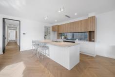 7 Waverley St Mitcham SA 5062 $2,450,000 - $2,650,000 Nestled in one of Adelaide's most sought-after suburbs, this brand-new designer home offers comfort, elegance, and a lifestyle many dream of. As you enter, sunlight pours through expansive windows, illuminating every corner and highlighting the home's high-end finishes. A grand hallway with a quiet study area provides the perfect space for working from home. The master suite is a peaceful retreat, complete with a large built-in robe, elegant dressing table, and beautifully appointed ensuite. Two additional bedrooms, each with built-in robes, ensure everyone has their own space, while a flexible second living room or fourth bedroom, offers options for family or guests. The central main bathroom features elegant finishes, a large shower and bath, and a separate toilet and basin, while a separate laundry provides convenient access to the outdoors. At the heart of the home is a stunning open-plan living area with a stylish gas fireplace and built-in cabinetry, seamlessly connecting the dining and kitchen zones. The kitchen is designed for both everyday living and entertaining, featuring a stone island bench, double oven, induction cooktop, abundant storage, and a butler's pantry with prep space and a secondary sink. Features not to be missed: • Intercom • Ducted reverse-cycle zoned air conditioning • Solar panels 13.2kw • In-ground swimming pool • Herringbone floorboards in all main areas • Built-in bar nook • Stone benchtops throughout • Built-in outdoor kitchen • Security system Step outside to your alfresco haven, complete with an outdoor kitchen featuring an inbuilt BBQ, sink, and storage. Enjoy summer nights entertaining while overlooking the sparkling in-ground pool and beautifully landscaped rear yard. Located just 7 km from Adelaide's CBD with easy access to the Adelaide Hills, Mitcham offers a leafy, family-friendly lifestyle. Excellent nearby schools, shops, cafes, and Mitcham Square provide convenience, while parks and scenic reserves offer a touch of nature. This is more than a house, it's a home designed for families or those seeking a low-maintenance lifestyle with space to grow, entertain, rest, and enjoy the very best of Mitcham living.