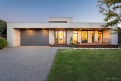 15 Relph Ave Portsea VIC 3944 This is a rare and unparalleled opportunity to acquire this outstanding home with stunning golf course views. The experience begins at the front gate leading to a beautiful low maintenance garden and Gosford stone entry immediately capturing views from the front door. Architect designed with timeless high quality finishes, this light filled home with high ceilings comprises of 4 generous bedrooms, 3 with ensuites and family bathroom including master with garden aspect. Kitchen living dining all capturing golf course views and integrating to outdoor entertaining area with north facing solar and gas heated pool and surround sound. Championship size tennis court, 48 Solar panels on the roof and double garage with internal access. Front and rear lighting and two gas fireplaces. Second living area with pool aspect and many extra features to enhance this home. Just in excess of 1738 sqm on two titles this multi generational single level home will make memories for years to come.