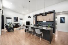 37A Redgum Drive Mansfield VIC 3722 $800,000 - $880,000 This stunning residence captures the perfect balance of space, style, and effortless low-maintenance living. Abundant natural light filters through expansive north-facing windows, accentuating the soaring ceilings and sophisticated, contemporary interiors. Designed by Ben Willick and built by Wilkon Building, this home showcases exceptional craftsmanship, thoughtful design, and a seamless connection between indoor and outdoor living. At its heart lies a beautifully proportioned open-plan kitchen, living, and dining area - where double stacker doors open to a covered alfresco, ideal for relaxed entertaining. The designer kitchen impresses with a stone island bench, 900mm oven, gas cooktop, and integrated dishwasher. The master suite offers a private retreat with a walk-in robe and luxurious ensuite, complemented by two additional bedrooms, a sleek main bathroom, and a convenient powder room. Additional features include double glazing throughout, zoned heating and cooling, a drive-through garage with internal access, and secure storage. Set on a landscaped 371m² (approx.) allotment, the property features a charming, low-maintenance garden - a tranquil spot to potter, unwind, and enjoy a touch of greenery without the upkeep. Perfectly positioned just moments from the Botanic Gardens and only minutes from High Street cafés, restaurants, and shops, this home offers an enviable lifestyle of comfort and convenience. Book your inspection today and experience the lifestyle you've been dreaming of.