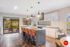 2 Ridgeway Crescent Kyneton VIC 3444 $1,150,000 - $1,250,000 Sitting proud on approx. 1207m² in a welcoming, family-friendly pocket, this spacious, light-soaked home is the kind of place where life just works. Where the floorplan flows, the outlook stuns and there's a spot for every member of the family to spread out, chill out or entertain to their heart's content. At the centre of it all? That open-plan kitchen/dining/living space - elevated and airy, with sweeping views of the surrounding countryside that somehow make dinner taste better and mornings feel a little slower (in the best way). The entertainer's kitchen features a 900mm dual-fuel cooker, a walk-in butler's pantry and a layout that keeps the chef connected to the conversation - whether it's midweek meals or milestone celebrations. Movie night? Sorted. There's a dedicated cinema room that delivers the gold-class experience without the overpriced popcorn. Need a space for teens to retreat, guests to relax, or mates to come by for the footy? Head downstairs, where a separate zone with its own entrance, inbuilt bar, toilet and billiards table is ready for whatever you throw at it (figuratively, of course). And when it comes to the practical stuff? This home overdelivers. All five bedrooms are conveniently located on the main level, including a generous main suite that feels more like a retreat - complete with a private ensuite and a walk-in robe that channels serious Sex and the City vibes. Think space, style and room for every heel, handbag and statement coat. There's also a large family bathroom and excellent storage options throughout - with built-in robes, generous linen space and room to keep everything effortlessly organised. Step outside and the magic continues. A wide undercover balcony invites you to sit back and soak in those breathtaking rural views - perfect for morning coffee or evening drinks. Just off the kitchen, a large undercover alfresco area draped in a trellised vine is perfectly positioned for effortless entertaining and leisurely meals - just imagine summer lunches and twilight dinners under the leaves. The terraced backyard is as versatile as it is charming, with space for play, veggie patches, a chicken coop and a firepit - your very own slice of country life, with all the convenience of town. Positioned on a corner block with two entry points to the home, this residence offers added privacy and convenience. Comfort is covered by multiple split-system, supported by banks of solar panels that keep running costs low. Meanwhile, the living area's wood heater beckons for cosy nights in with a glass of red, perfectly paired with those stunning views. This is the kind of home your kids will be proud to bring their friends to-and the one you'll be excited to host your housewarming in. All just a stroll from schools and shops, with quick freeway access making Melbourne or Bendigo commutes a breeze. Key Features: • Spacious family home with cinema room & downstairs retreat • Stunning country views from open-plan living & wide balcony • Main suite with ensuite + walk-in robe - serious style vibes • Incredible storage throughout for the modern minimalist lifestyle