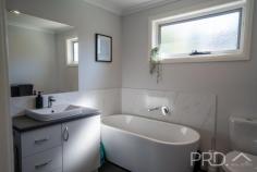 4 / 63 Bundara Crescent Tumut NSW 2720 $610,000 Positioned in a quiet enclave just a few moments' drive from all major local amenities. This modern three-bedroom family home offers a sleek design, with open plan living and modern creature comforts, all complimented by ample space in the rear yard to entertain family and friends, also boasting dual side vehicle access. 4/63 Bundara Crescent is a fantastic low maintenance and modern design opportunity not to be missed. Do not be beaten by your competition, call today to book your inspection. Premiere Features: - King size master bedroom boasting triple built in robes, ceiling fan and ensuite - Ensuite with shower, toilet and single vanity - Two queen sized bedrooms, both with double built in robes and ceiling fans - Great size main bathroom with separate bath and shower, toilet and single vanity - Kitchen boasting gas cooktop, dishwasher, ample storage and bench space and double sink overlooking the rear yard - Open plan dining positioned directly off the kitchen with direct external access - Great size living area upon entry and serviced by ceiling fan and split system reverse cycle air conditioning - Internal laundry with ample storage and direct external access - Single garage with automatic roller door - Fully fenced and landscaped rear yard with vehicle access on both sides of the home, all complimented with established Manchurian pears that offer great privacy - Rainwater tank - Low maintenance front yard - Approximate 696m² allotment - Gas hot water connected - LED downlighting connected - Currently tenanted at $570 per week until April 2026 With ample opportunity in the rear yard for additional shedding or swimming pool. 4/63 Bundara Crescent is a sleek and modern designed family home with ample opportunity for growth. Do not miss your opportunity to secure such a fantastic opportunity.