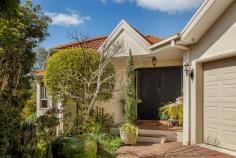 5 Sweetfern Dell Frankston South VIC 3199 $1,650,000 - $1,815,000 Located on the crest of Oliver's Hill and nestled on the edge of Sweetwater Creek Reserve, this lovingly maintained property offers a wonderful lifestyle, with walks through the Reserve and only minutes to the beach. Experience the magic of treetop living, where daily bushland strolls are accompanied by the enchanting melodies of Kookaburras, a dream come true for true nature lovers. A light-filled social domain welcomes casual entertaining beyond a formal lounge, with spacious living and dining dimensions uniting with an equally-large verandah, complete with awning and views to the European garden. A modern kitchen with Fisher & Paykel cooking appliances, a Bosch dishwasher, and generous stone benchtops keeps everyone together in one space, while a downstairs patio provides a sheltered outdoor area for more intimate gatherings. A ground-floor master suite featuring walk-in robe and dual vanity ensuite presents alongside a secondary bedroom to provide single-level living for downsizers, while two additional bedrooms, a family bathroom with private toilet, and a functional laundry occupy the lower level. Additional features include a separate powder room, generous storage alternatives, a rear gazebo and pergola, lush gardens featuring a variety of fruit-bearing trees, and a double garage with internal access, while comfort extends with gas ducted heating, an alarm system, and modern floors throughout. Celebrating a prestigious FHSZ address atop Oliver's Hill, where the best schools, hospitals, community services and shopping precincts, such as Frankston Bayside, Mt Eliza Village, and Mornington, are all within reach.