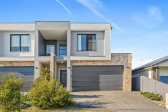 13A Banjo Street Albion Park NSW 2527 Boasting luxurious inclusions and high-end finishes throughout, this Torrens-titled residence sets a new benchmark for modern family living. Every detail has been carefully considered, from the soaring ceilings in the garage to the custom stone kitchen, delivering a home that is both stylish and functional. Nestled in the exclusive Highlands Estate with escarpment views, it offers a private retreat while keeping you connected to Albion Park, Shellharbour, and Wollongong. Premium features you'll love: • Three generous bedrooms and two designer bathrooms finished with floor-to-ceiling tiles and a freestanding bath • Double garage with exceptionally high ceilings, complemented by a wide double driveway for extra parking • Ducted air conditioning for year-round climate comfort • Gourmet kitchen showcasing 40mm deluxe stone benchtops, premium appliances, and a chic contemporary design • Open-plan living and dining with quality vinyl plank flooring for a seamless flow • Bright alfresco entertaining area overlooking a level, child-friendly backyard • Private courtyard and water tank, blending luxury with practical living • Positioned in a whisper-quiet street surrounded by other prestige homes Just five minutes from Albion Park town centre, twenty minutes to Shellharbour's beaches, and an easy half-hour commute to Wollongong, this home combines convenience with absolute sophistication.