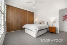 6 Finniss Ct North Adelaide SA 5006 $990,000 - $1,089,000 Tucked quietly off Finniss Street within an exclusive court, this renovated townhouse offers the ideal lock-up-and-leave lifestyle in one of Adelaide’s most coveted city-fringe pockets. Perfect as a home base for the busy professional, a secure investment or potential Airbnb, every inch has been thoughtfully designed for comfort, light and effortless liveability. Step inside to the heart of the home where you’ll find a light-filled open plan kitchen, living and dining space that instantly feels warm and welcoming. Timber floors flow underfoot, while plantation shutters and French doors frame the courtyard beyond, filling the space with soft natural light. The kitchen impresses with sleek cabinetry, a generous island bench and walk-in pantry providing abundant storage, complemented by premium Smeg appliances and a Miele dishwasher. A clever under-stair nook offers a versatile space for a study or breakfast bar, while a discreet powder room adds thoughtful convenience for guests. Upstairs, two spacious bedrooms each enjoy their own bathroom, creating flexibility for guests or shared living. The master features a wall of built-in robes and a generous ensuite with bath, while the large main bathroom doubles as a laundry with concealed washer and dryer space. Enjoy living moments from Adelaide Oval, O’Connell Street, Melbourne Street and the CBD, with the Parklands forming your extended backyard. Wander to the British Hotel or the Lion Hotel for a relaxed meal in the sun or take advantage of nearby public transport and cycling trails connecting you seamlessly across the city. Zoned for North Adelaide Primary and Walkerville Primary, as well as Adelaide Botanic and Adelaide High Schools. Prestigious private options including Wilderness School, St Dominic’s Priory and St Peter’s Boys are all within easy reach. FEATURES WE LOVE • Built 2002, renovated 2019 • Quiet court off Finniss Street • Ideal city pad, investment or potential Airbnb • Light-filled open plan living and dining • Sleek kitchen with Smeg appliances & Miele dishwasher • Island bench, walk-in pantry & understairs study nook • French doors to private courtyard • Guest powder room on lower level • Two bedrooms, each with own bathroom • Master with built-in robe & ensuite • European laundry in contemporary main bathroom • Ducted reverse-cycle air conditioning & ceiling fans • Plantation shutters throughout • Timber floors downstairs, carpet upstairs • Intercom & single car garage LOCATION • Unbeatable city-fringe setting • Enjoy a lifestyle of cafés, culture and green open space all at your doorstep • Walk to O’Connell Street, Melbourne Street, Adelaide Oval and the CBD • Moments from the British and Lion Hotels for casual dining options • Easy access to Adelaide’s universities and public transport SCHOOL ZONES • Zoned for North Adelaide and Walkerville Primary Schools • Zoned for Adelaide Botanic High School and Adelaide High School • Close to Wilderness School, St Dominic’s Priory College and St Peter’s Bo