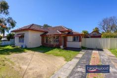 4 Afric St Middle Swan WA 6056 $649,000 An opportunity where family sanctuary meets strategic investment on a substantial 971 sqm block. This original 1950s residence offers the immediate rewards of generous family living alongside the long-term prospects of R20 development potential, subject to necessary approvals. An enviable position transforms a spacious family home into a truly strategic acquisition. Currently tenanted until April 2026. 3 bedrooms 1 bathroom 1953-built brick and tile Lounge sunroom & activity Updated central kitchen Sep games room and study High ceilings throughout Big backyard level fenced Pwd weatherboard garage 971 sqm block zoned R20 Behind a screen of clipped Lilly Pillys, this charming home welcomes you through a traditional front porch featuring period-defining painted concrete flooring. A small entrance hall leads seamlessly to the generously proportioned principal bedroom, complete with split-system air conditioning and a ceiling fan for year-round comfort. The formal lounge, also equipped with split air-conditioning, provides a sophisticated space for relaxation. At the same time, the spacious family bathroom, conveniently located near the principal bedroom, serves the home with both a bathtub and separate shower facilities. Central to the floorplan is an updated kitchen offering ample under-bench storage, an electric oven, and a gas cooktop – perfect for both everyday meals and entertaining. High ceilings throughout enhance the sense of space and airiness, creating an immediately welcoming atmosphere. What was originally the rear verandah is now transformed into a central, east-facing sunroom that floods the interior with natural light. Bedrooms positioned at either end of this central space create a wonderful sense of connection with the outdoors and give kids a space of their own. Adjoining the sunroom is a large, multi-use space featuring dual-aspect glazing. This light-filled room serves beautifully as a family room, games area, or additional entertaining space. Direct access to the fully fenced backyard creates seamless indoor-outdoor living. The east-facing backyard is a family paradise, extending from a central paved patio to a generous level lawn area. Mature fruit trees provide both shade and seasonal produce, while the original washhouse and powered weatherboard garage add character and storage. Practical features include high gates providing drive-in access to the garage, plus additional off-street parking at the front of the property – ensuring convenience for multiple vehicles. Currently tenanted until April 2026, this property offers immediate rental returns for investors, providing time to explore the development possibilities that the R20 zoning presents. Whether you’re seeking a comfortable family residence, a sound investment, or a development opportunity, this exceptional property delivers on all fronts. This enviable address places you moments from quality schools, sporting facilities, and the vibrant heart of local shops and services. The nearby train station ensures effortless connectivity, making this an ideal choice for growing families or astute investors.