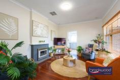 4 Narla Pl Koongamia WA 6056 $639,000 Nestled at the quiet end of a cul-de-sac, this charming 1950s cottage captures the essence of relaxed foothills living. Set on a generous 878-square-metre block with sub-divisible potential, the home is framed by cottage-style gardens that create an inviting sense of arrival. 3 bedrooms 1 bathroom 1959-built Fibro and tile Jarrah floor high ceiling OP kitchen/meals w AC Formal lounge w SC fire Freshly painted through Ducted evap + 2 splits 878 sqm block R20/35 Shed/storage/OS parking A pathway travels through established plantings to the welcoming front verandah of this impressive Koongamia home. Inside, original jarrah floors and high ceilings speak to the home’s heritage, creating spaces that feel both gracious and grounded. The formal lounge, anchored by a slow combustion fire fitted into the original fireplace, offers a cosy retreat, its large west-facing window framing leafy garden views. A sliding door connects this room to the open-plan kitchen and meals area, where white and grey cabinetry, a freestanding electric oven and split-system air conditioning combine to create a bright, functional hub for daily living. A door opens from the kitchen to the front verandah, introducing an easy indoor-outdoor flow perfect for casual alfresco dining as the day winds down. To the rear of the kitchen, a generously proportioned walk-through laundry leads to a wide east-facing verandah overlooking cottage gardens, blossom and trees that fill the backyard with seasonal colour. The principal bedroom is situated at the front of the home, where generous proportions, a picture window, and a lofty ceiling create an airy, light-filled retreat. Garden views through the window bring a sense of calm, while carpet underfoot and split-system air conditioning ensure year-round comfort. Two additional bedrooms offer flexible accommodation. The rear room features an east-facing window with garden aspects, while the second junior bedroom provides ample space for a double bed. Both bedrooms have polished jarrah floors. The shared family bathroom has been thoughtfully updated with full tiling, a walk-in shower, vanity and built-in storage, while a separate WC adds practical convenience. Beyond the back door, the property reveals its authentic charm. The rear garden is a generous, sun-dappled space where mature trees offer shade and cottage-style plantings soften the boundaries. It’s the kind of yard that invites weekend mornings with a book, summer barbecues and the simple pleasure of watching the seasons change. The Heritage Trail runs along the side boundary, offering hours of walking and riding amidst the natural beauty of the Perth Hills. The top-of-the-cul-de-sac position ensures peace and privacy without sacrificing accessibility. Koongamia strikes a rare balance – a foothills suburb with genuine character, and practical access to Midland, public transport and Perth Airport, keeping the city within easy reach. This cottage embodies that balance perfectly: original charm and modern convenience, generous gardens and subdivisible potential, quiet comfort and connected living. For those seeking a character home with flexibility, space and a location that truly delivers, this is an opportunity worth seizing.