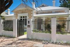 20 Fashoda St Hyde Park SA 5061 Completed in 2025, a spectacular architectural makeover has elevated this c.1910 sandstone fronted villa into an extended contemporary masterpiece that fuses elegant traditional design with a sophisticated and refined aesthetic that is truly next level. With an outstanding lifestyle location in the tranquil treelined heart of exclusive Hyde Park, this stunning family retreat boasts high end features, a glorious easy-care landscaped garden, valuable north facing rear and a pool. Sitting beautifully beside contemporary design elements, original features include a tessellated tiled veranda with timber adornment, pretty stained glass, decorative mantles and ceiling roses. From the long light filled arched hallway with timber boards and panelled walls, the spacious principal rooms include a chic living room with a basket chandelier and library shelves, and three bedrooms. The primary bedroom is a sanctuary of understated luxury with a huge walk-in robe with custom joinery extending into the designer ensuite with indulgent under floor heating, dual vanities and a courtyard garden aspect. Also with heated flagstone floors, the main bathroom, laundry and guest powder are of exceptional design and quality. The 2025 transformation extends into the sensational north facing living extension - a curated contemporary masterpiece of effortless entertaining and family comfort. Grounded by heated flagstones, wow-factor living is warmed by a gas fire and is connected to and overlooks the rear garden and pool through a series of steel framed arched French doors. The flawless kitchen wraps around a central island, and hosts a range of integrated Miele appliances, a fabulous white Smeg cooker and a large Butler’s pantry with a second dishwasher, second fridge and extensive storage. Bi-fold servery windows connect indoor prep to the outdoor dining pavilion with a beefeater BBQ and louvred ceiling. The flagstones seamlessly transition to outside living beneath a steel framed cloister. Bathed in sunshine, the rear lawns embrace the heated magnesium pool. A backdrop of Lilly Pilly wraps to the side towards a private side lawn and drying yard. Perfectly placed between the lifestyle delights of King William and Unley Roads and only minutes from the CBD and premium schools, there is nothing left to do except move in and enjoy. FEATURES TO LOVE • Architectural renovation by Aspect Studio and Mosmo Building completed 2025 • Original architectural features • Heated magnesium pool with glass fence • Remote entry gate and garage with rear roller door garden access • Smeg cooker, integrated Miele dishwashers, Miele fridge & fridge/freezer • Pot filler, insinkerator • Zoned & ducted R/C air conditioning • Underfloor heating in bathrooms, laundry, powder, open plan living & pantry • Gas fire • Plantation shutters • Solar panels • Extensive custom joinery by Packers • Pedestrian gate intercom • Automatic irrigation • Pool equipment room & workshop • Utility yard • Vegetable beds LOCATION: Premier lifestyle position approx. 3km from South Terrace LIFESTYLE: Walk to the pubs, cafes and boutique shopping of Unley Road & King William Road. Short walk to Unley Oval, Heywood Park EDUCATION: Zoned to Unley Primary & Unley High. Enquiries may be made to Glenunga International, Adelaide Botanic & Highgate Primary. Walk to Walford