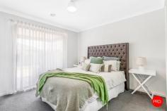 75 Lanark Drive Junortoun VIC 3551 $800,000 - $850,000 Tucked in a quiet Junortoun pocket, this light-filled home feels immediately calm and family-friendly. Wide glazing draws the garden in, the living zones flow with ease, and the decked alfresco overlooks a private, established backyard - perfect for long lunches, trampoline time and golden-hour sunsets. Inside, the layout is wonderfully practical. A welcoming front lounge offers a peaceful second living space, while the main family/dining zone opens wide to the rear deck for effortless indoor-outdoor living. The crisp white kitchen is the hub of the home with great storage, stone-look benches, 900mm gas cooking and a full-length island that keeps everyone connected from breakfast to bedtime. Accommodation is generous and well zoned. The main suite enjoys garden outlooks, a walk-in robe and a neat ensuite. Three additional bedrooms feature built-in storage and are serviced by a family bathroom with separate toilet. A handy study nook sits by the living zone - ideal for homework or work-from-home days - and a fitted laundry has direct outdoor access. Comfort is covered with ducted heating and evaporative cooling, while solar hot water helps keep running costs sensible. Outside, established hedging wraps the backyard in privacy, there's a broad timber deck for entertaining, a gravel utility area, and excellent side access alongside the double garage - perfect for a trailer or small van. From here you're moments to bushland trails, Strathfieldsaye and Junortoun amenities, quality schools and an easy run into the CBD. A move-in-ready family home with space to grow into - and a backyard you'll actually use.