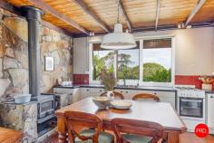 120 Miners Hut Road Chewton Bushlands VIC 3451 $880,000 - $950,000 ENTER VIA SPARKS AVENUE > SPARKS ROAD > MINERS HUT ROAD > WALLABY CRESCENT There's a moment each day when Chewton Bushlands holds its breath. The sun slips low and the sky throws every shade of apricot and mauve across the ridgelines. That's Ukamirra - "sunset" in an Australian Aboriginal language - a fitting name for this stone cottage on a private hilltop, day after golden day. Set on approximately 7 acres of native bushland, on the Melbourne side of Castlemaine (10 mins away), Ukamirra feels like a Swiss alpine refuge reimagined for central Victoria. Hand laid local stone, a giant old oak on the house platform and long views that roll all the way to Mount Macedon and Mount Franklin. Inside, the mood is warm and honest. A comfy lounge anchors the home, with a separate kitchen/dining hub for slow breakfasts and long, chatty dinners. There are 3 bedrooms plus a kids' mezzanine for cubby like dreams and a bright bathroom. Ukamirra runs beautifully off-grid, just as most homes in Chewton Bushlands do. The system is clever, so you can focus on the sunsets, not the switches. The stone keeps things naturally cool in summer with pedestal fans on hand, while winter is well sorted with two wood fires and a hallway gas heater to take the chill off. Why you'll love it: • Hilltop position with panoramic views to Mount Macedon and Mount Franklin • Beautiful local stone cottage with the romance of an alpine lodge and the soul of central Victoria • Giant oak shading the house platform - breakfast, lunch and dinner outdoors • Starry-night BBQs, winter firelight and the daily theatre of sunset that inspired the home's name The details: • Land: approximately 3.07 hectares (approx. 7.5 acres) • Heating/Cooling: 2 Nectre wood fires (lounge and kitchen), hallway gas heater, stone construction that holds summer cool, flyscreens throughout • Power: off-grid system with 4.5 kW Selectronic inverter, 12 x 400Ah batteries, 8 x 200 W solar panels and backup:8 kW diesel generator • Water: approx. 25,000 litre house tank • Carport • Setting: nature reserve along the eastern boundary and a friendly, private neighbourhood Wildlife are your closest neighbours. Expect kangaroos at dawn, a chorus of native birds and the soft hush of the bush. On hot days, pack the swimming noodles and wander down to Golden Point Reservoir - the locals' lake - just 7 minutes away to float with ducklings and reset. Ukamirra is a quiet, creative hideaway with proper views and a deep sense of calm. Come late afternoon, when the light softens and the ridgelines turn violet, you'll understand why the name fits like a glove. This is a home for sunset collectors, stargazers and anyone who believes life is better when it's grounded in nature.