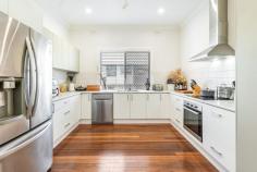 27 East St Casino NSW 2470 $580,000 Discover the timeless charm of this beautifully renovated 3 bed plus ensuite Queenslander. This stunning home captures the charm of yesteryear with the convenience and style of modern living and features polished floors throughout. Located within an easy walk to the CBD in a quiet leafy neighbourhood there is nothing left to do here except move in and enjoy Fully renovated after being affected by the 22 floods, this gorgeous home boasts many original period features and offers spacious, light filled, yet cosy living with 2 family rooms plus a light filled sunroom to the rear of the property. The property offers: Main Bedroom with stunning Ensuite and built in wardrobe 2 additional generously proportioned bedrooms, one with built in robes, the other with stunning French doors leading on to the front veranda and Air conditioning 2 living areas plus an additional sunroom to the rear of the property Stunning modern kitchen with quality appliances, heaps of storage and endless bench space. Stylish and generously proportion modern family bathroom. To the rear of the property you will find a generous undercover entertainment area that overlooks the fully fenced rear garden that is mainly laid to lawn and offers amply space for children and pets to play, and also features a garden shed.