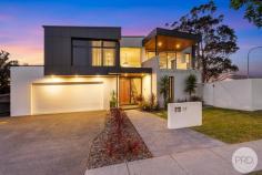 17 Dockside Avenue Corlette NSW 2315 Setting a new benchmark for modern luxury, this like-new residence delivers a flawless balance of sophistication, functionality, and effortless coastal living. Thoughtfully designed across a generous 721m² parcel, this architecturally designed, and master built home has been crafted to embody comfort, style and enduring quality. Clean lines, high ceilings and an abundance of natural light define the home's aesthetic, where micro cement finishes and a soft neutral palette create a warm yet architectural feel. The open-plan living, dining and kitchen zone forms the heart of the home, a space that feels both expansive and intimate. Anchored by a statement island bench, the kitchen features premium appliances, custom cabinetry and seamless integration from the kitchen to the butlers pantry. With multiple living zones, this home ensures flexibility for all family's lifestyles. Unwind in the dedicated media room, enjoy family dinners around the table, or step outside to the alfresco area, where indoor and outdoor living blend effortlessly. Overlooking the sunlit pool and landscaped gardens, it's the perfect setting for laid-back afternoons or summer entertaining. Accommodation includes four beautifully appointed and oversized bedrooms, each designed as a private retreat. Take your choice, as there are two master suites, both with a walk-in robe and contemporary ensuites featuring refined finishes and subtle luxury. Featuring: - Architecturally designed, master-built residence showcasing a striking contemporary facade and refined interiors - Expansive open-plan layout seamlessly connecting the kitchen, living, and dining zones - Gourmet kitchen equipped with induction cooking, a walk-in butler's pantry, and a picturesque outlook over the pool area - Four generously sized bedrooms, complemented by three luxurious bathrooms and a dedicated home office - Solar electricity, ducted air conditioning, ducted vacuum, security camera and intercom system - Large undercover alfresco area overlooking the sparkling resort-style, self-cleaning, naked filtration system, 15m heated swimming pool - Massive triple lock-up garage with internal access Location: - Approximately 2 minute's drive to Salamander Bay Shopping Centre - Approximately 3 minute's drive to the pristine shores of Dutchmans Beach and Bagnalls Beach From morning swims to quiet evenings spent under the stars, this home captures the essence of relaxed sophistication. Set within a peaceful and private street, the location perfectly complements the lifestyle, close to local beaches, cafes, schools, yet wonderfully secluded.