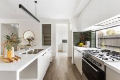 19 Buna Avenue Seaford VIC 3198 $1,050,000 - $1,150,000 A striking showcase of contemporary design and effortless comfort, this brand-new two-storey residence delivers luxurious family living with every modern inclusion in a tightly held coastal location. Positioned on a corner block with dual street access, this immaculate four-bedroom, three-bathroom home caters beautifully to growing or multigenerational families seeking style, space, and substance by the sea. Downstairs, the ground-floor master suite is a tranquil retreat with a walk-in robe and luxe ensuite, while a second master with ensuite and WIR upstairs offers additional privacy and flexibility for extended families or guests. The main living domain is flooded with natural light from a dramatic skylight and anchored by engineered timber floors, connecting seamlessly to a paved north-facing outdoor patio, the ideal setting for alfresco dining and summer entertaining. A true highlight is the state-of-the-art kitchen, featuring a stone breakfast bar with statement pendant lighting, an InAlto dishwasher, Solt 5-burner gas cooktop, oven and a stunning frameless glass splashback window. A full walk-in pantry and generous laundry ensure both practicality and visual appeal. Upstairs, a large retreat creates the perfect second living zone or kids' play space, framed by two additional bedrooms, each with robes and split system climate control. A central bathroom with a full-size tub and walk-in shower continues the luxe theme with floor-to-ceiling tiling and designer pendant lighting, complemented by a downstairs powder room and under-stair storage. Thoughtfully finished throughout with a mix of engineered timber floors, plush carpets and sleek tiles, this home also features split system heating/cooling in every bedroom and living zone, a rainwater tank, and a remote double garage with internal access. Ideally positioned for both lifestyle and convenience, this brand-new home is just moments from the golden sands of Kananook Beach, offering morning strolls along the coast and sunset swims at your doorstep. Commuters will love the short walk to Kananook Station, providing direct access to the CBD, while families are well-serviced by nearby parks, local schools, and vibrant shopping hubs including Seaford Village and Frankston. With easy access to the freeway and Peninsula Link, you'll enjoy seamless connectivity to the Mornington Peninsula, making this an exceptional base for relaxed bayside living with every urban convenience close at hand.