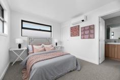 1/3 Lorna Street Seaford VIC 3198 $730,000 - $800,000 Cleverly designed to create a masterful combination of space, light, and detail, this dual-level home boldly delivers a low-maintenance luxury with its recently finished interiors that feature quality finishes, open living areas, and energy-efficient solutions. Employing tasteful contrast and warm timber tones, the first of just three homes introduces its private living spaces with an open-plan social domain featuring space for living and dining alongside a hard-working kitchen featuring modern stainless steel appliances, stone benchtops with a breakfast bar overhang, and functional storage options. A timber staircase unites the four bedrooms and three bathrooms, cascading across both levels to present adaptable living arrangements, with dual master suites each featuring a premium carpet and private ensuite. Accompanied by a ground floor powder room and a double garage with rear laundry facilities, the home includes multiple split-system heating/cooling units throughout, elevated ceiling heights, clothesline, rear garden shed, rain water storage, and a landscaped frontage with secure boundaries. Enjoy total convenience, with close proximity to Seaford Beach, Kananook Train Station, Bayside Shopping Centre, and Peninsula Link access.