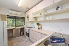 3 Tee Ave Mundaring WA 6073 $850,000 A rare chance to claim almost an acre of established gardens in the heart of Mundaring village, where towering gums and mature plantings create a private world just moments from cafes, shops and schools. 3 beds 1 bath 2 WCs 1994 cedar and iron Airy open floor plan Formal dining room OP kitchen lounge Wrap deck verandah Big under croft space Scheme water & retic 3693 sqm hidden lot Magic in Mundaring The sense of arrival here is immediate. A long driveway moves through layered gardens before delivering you to a cedar home that seems to float among the trees. This is proper privacy – the kind that makes you forget the village centre is just a five-minute walk away. You could be deep in the hills, yet the bakery, supermarkets and coffee are all within easy reach. The home presents a straightforward floor plan that works well for daily life. A central hallway provides clear separation between living spaces and the bedroom wing, with the formal dining room occupying an elevated corner position that places you in the canopy. Morning light filters through established trees, and the room feels more treehouse than traditional dining space. The kitchen is practical rather than showy, fitted with a freestanding oven, dishwasher and a servery window that maintains connection to the dining room. From the carpeted lounge room, a sliding door opens to the front deck – a generous space that becomes an extension of the living area in the warmer months. The reverse-cycle air conditioning handles summer heat, while the mature trees provide natural cooling and the dappled shade that makes outdoor living enticing. The bedroom wing is sensibly arranged. Two bedrooms share the family bathroom, with the current principal bedroom benefiting from split system air conditioning and a ceiling fan. The adjoining powder room can also be accessed via the deck, a detail that proves its worth when you’re entertaining or working in the garden. The first bedroom connects to a spacious storeroom with a dropped floor – a ready-made opportunity for conversion to a second bathroom if that suits your needs. A walk-through laundry with a separate toilet completes this section of the home, and those two double linen presses in the hallway solve the eternal storage question. But step outside, and the real story unfolds. Almost 3,700 square metres of gardens wrap around the house in layers – a mix of native eucalypts, established exotics, fruit trees and the remnants of structured garden beds. The bones are excellent. This was clearly a considered landscape in its day, and while it needs attention now, the framework remains. You can see the potential garden rooms, imagine the restored vegetable beds, picture the fruit trees producing again. The reticulation system is already in place for sections of the garden, and scheme water is connected. This is the kind of property where children create elaborate games among the trees, where you spend weekends gradually bringing order to the wilder sections, and where the undercover area beneath the house suggests possibilities for a workshop or studio space. Friends arrive for lunch and stay until evening, drawn by the atmosphere of seclusion and the novelty of finding such expansive grounds so close to everything. The location delivers genuine convenience – walking distance to the village means less time in the car and more time at home. Mundaring Primary School sits nearby, with Parkerville Steiner schools or Helena College for secondary education. Midland is a 20-minute drive for major shopping and services, the airport is 35 minutes away, and Perth CBD is accessible in around 45 minutes. Yet the property feels entirely removed from the chaos of suburbia.