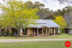 23 Strawhorn Court Kyneton VIC 3444 $950,000 - $1,045,000 If you've ever pictured yourself waking up to water views, wandering through and sipping coffee, watching kangaroos, as the morning mist lifts off the dam, this is your moment. From every room, there's a view worth framing, mesmerising outlooks that shift with the light, from rippling reflections on the water to the lush greens of the garden. You'll hardly need artwork when nature's doing the job for you. Inside, the cabin wraps you in warmth and charm. Think cove timber-lined ceilings, polished concrete floors and that wonderful mix of rustic texture and relaxed style. A crackling wood heater in the lounge sets the tone for winter nights, while split system heating and cooling keeps things perfectly comfortable year-round. The kitchen enjoys the same calming outlook, making every meal a moment to savour. The living spaces invite you to slow down, settle in and soak up the peace. Outside, it's pure magic. Expansive lawns down to the water's edge, incorporating beautiful established European shade trees and gardens that create a sense of timeless calm. Behind the dam, a pocket of bushland invites an easy afternoon wander for nature lovers or a playground for children, with the dam itself alive with yabbies and turtles, and spaces for collecting wood for the fire, family and friend gatherings, or quiet nights under the star-filled skies by the fire-pit. There's shedding with a carport, a woodshed, water tanks and solar, everything you need to live comfortably and lightly. It's relaxed, it's inviting and it's got that rare kind of charm that feels like a deep breath out. Whether it's your weekend hideaway or your forever escape, this one's all heart.