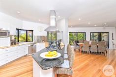 50 Danalene Parade Corlette NSW 2315 Nestled in an exclusive and tightly held enclave of Corlette, this exceptional residence embodies sophisticated coastal luxury just 100m to the waters edge and 500m from the sparkling waters of Roy Wood Reserve Beach. Backing directly onto peaceful reserve land and capturing blue vistas from multiple areas of the home, it offers an unparalleled lifestyle opportunity for those seeking elegance, space and a truly premium coastal address. Bathed in natural light and designed to celebrate its breathtaking surrounds, the home's bright interior showcases large picture windows framing sparkling water views and lush green outlooks. A refined coastal-inspired colour palette, quality finishes and a seamless indoor-outdoor flow elevate the home into a warm and inviting sanctuary. The main residence features a contemporary open-plan kitchen, living and dining space, perfectly positioned to overlook the water. The expansive kitchen is a statement in itself, complete with a generous island bar and elevated sea views-an ideal setting for effortless family living and stylish entertaining. A second family room provides additional flexibility, offering a quiet retreat and an ideal spot for relaxation or separate entertaining away from the main living zones. A true highlight of the home is the expansive outdoor entertaining areas. The main elevated deck is framed by low maintenance manicured gardens and tropical palms, overlooking lush reserve greenery and capturing beautiful vistas and magical sunsets. To the rear, a second covered deck creates an additional alfresco and BBQ area, ideal for year-round entertaining in a more private setting. Accommodation throughout the home is exceptional. All five bedrooms are generously sized and fitted with built-in wardrobes, while the luxurious master suite enjoys commanding water views and a private ensuite, delivering a resort-like experience. Adding significant versatility and appeal, the fully self-contained unit offers income potential through short- or long-term leasing, or an ideal solution for multigenerational living, guests or independent family members. Practicality meets lifestyle with an extra-large double garage featuring built-in storage cabinets and workbenches, complemented by ample additional off-street parking for cars, boats or visitors. The home is further enhanced by an impressive 28 solar panels paired with a 10.5kW inverter, providing excellent energy efficiency and reduced running costs. Additional features include a dedicated office with separate entry and bathroom, plantation shutters, air conditioning, and ceiling fans throughout. A short 320m tree lined walk will see you on the white sands of Corlette Beach and at the door step of the world-class Anchorage Marina, the residence offers enviable proximity to beachside strolls, boating, waterfront dining and the serenity of nature right at your back door. This is more than a home-it is a prestigious coastal haven in an elite location, offering a rare combination of water views, versatility, natural beauty and timeless appeal. A remarkable opportunity to secure a truly unique residence in one of Corlette's most desirable settings.