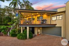 50 Danalene Parade Corlette NSW 2315 Nestled in an exclusive and tightly held enclave of Corlette, this exceptional residence embodies sophisticated coastal luxury just 100m to the waters edge and 500m from the sparkling waters of Roy Wood Reserve Beach. Backing directly onto peaceful reserve land and capturing blue vistas from multiple areas of the home, it offers an unparalleled lifestyle opportunity for those seeking elegance, space and a truly premium coastal address. Bathed in natural light and designed to celebrate its breathtaking surrounds, the home's bright interior showcases large picture windows framing sparkling water views and lush green outlooks. A refined coastal-inspired colour palette, quality finishes and a seamless indoor-outdoor flow elevate the home into a warm and inviting sanctuary. The main residence features a contemporary open-plan kitchen, living and dining space, perfectly positioned to overlook the water. The expansive kitchen is a statement in itself, complete with a generous island bar and elevated sea views-an ideal setting for effortless family living and stylish entertaining. A second family room provides additional flexibility, offering a quiet retreat and an ideal spot for relaxation or separate entertaining away from the main living zones. A true highlight of the home is the expansive outdoor entertaining areas. The main elevated deck is framed by low maintenance manicured gardens and tropical palms, overlooking lush reserve greenery and capturing beautiful vistas and magical sunsets. To the rear, a second covered deck creates an additional alfresco and BBQ area, ideal for year-round entertaining in a more private setting. Accommodation throughout the home is exceptional. All five bedrooms are generously sized and fitted with built-in wardrobes, while the luxurious master suite enjoys commanding water views and a private ensuite, delivering a resort-like experience. Adding significant versatility and appeal, the fully self-contained unit offers income potential through short- or long-term leasing, or an ideal solution for multigenerational living, guests or independent family members. Practicality meets lifestyle with an extra-large double garage featuring built-in storage cabinets and workbenches, complemented by ample additional off-street parking for cars, boats or visitors. The home is further enhanced by an impressive 28 solar panels paired with a 10.5kW inverter, providing excellent energy efficiency and reduced running costs. Additional features include a dedicated office with separate entry and bathroom, plantation shutters, air conditioning, and ceiling fans throughout. A short 320m tree lined walk will see you on the white sands of Corlette Beach and at the door step of the world-class Anchorage Marina, the residence offers enviable proximity to beachside strolls, boating, waterfront dining and the serenity of nature right at your back door. This is more than a home-it is a prestigious coastal haven in an elite location, offering a rare combination of water views, versatility, natural beauty and timeless appeal. A remarkable opportunity to secure a truly unique residence in one of Corlette's most desirable settings.