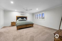 18 Lauremeg Place Logan Village QLD 4207 Refined family living meets outstanding versatility in this expansive Clarendon built double-storey residence, purposefully designed for large families, multi-generational living and those who value space for both entertaining and everyday comfort. Positioned on a generous 929m² block within the highly regarded My Home & The River Estate of Logan Village, the home offers an impressive blend of scale, functionality and lifestyle appeal, complemented by a fully self-contained attached dual-living granny flat. The ground floor centres around a spacious open-plan family and meals area, ideal for daily life and hosting gatherings. Flowing seamlessly from this hub, the kitchen features a walk-in pantry with integrated sink, stone island bench and gas cooking, creating a practical and inviting space for casual dining and entertaining. Air conditioning and ceiling fans ensure comfort throughout the main living zones. Entertainment and relaxation are well catered for with a separate, fully air-conditioned theatre room, providing a dedicated retreat away from the open living areas. A conveniently located powder room on this level adds everyday practicality. Upstairs, a large rumpus room delivers a flexible second living zone, perfectly suited to a children’s retreat, study area or informal lounge. The master suite is positioned as a private haven, complete with a walk-in robe and ensuite with dual vanities. Additional bedrooms are generously proportioned and fitted with built-in wardrobes, ceiling fans and air conditioning, while the main bathroom includes a shower, bathtub and the convenience of a separate powder room. Separate laundry with direct outdoor access enhances functionality, while a double remote-control garage provides secure parking and internal access. Outdoor living is equally impressive, with a covered alfresco area featuring downlights and a ceiling fan, ideal for entertaining or relaxed evenings at home. The expansive backyard offers space for children and pets, enhanced by an inground swimming pool, Bali hut and fire pit area, creating a true resort-style setting. A garden shed adds further practicality, all set within the substantial 929m² allotment. Energy efficiency is supported by 2 x 6kW solar systems with 24 panels, helping to reduce ongoing costs. Completing the home is the attached self-contained granny flat, offering excellent flexibility for extended family, guests or additional income. Featuring its own private entrance, patio and carport, the flat includes a well-appointed kitchen with pantry, an air-conditioned lounge and dining area, a bedroom with walk-in robe and a modern bathroom. This is a rare opportunity to secure a home of exceptional size and adaptability, delivering a lifestyle that comfortably evolves with your needs while offering space, privacy and outstanding outdoor amenities. Property Features: • Built by Clarendon Homes in 2017 and thoughtfully designed for large families, dual living or multi-generational households • Expansive double storey residence positioned on a generous 929m² block within the My Home & The River Estate, Logan Village • Fully self-contained attached dual living granny flat with private entrance, patio and separate carport • Plantation shutters installed throughout the home, enhancing privacy, light control and a timeless aesthetic • Modern kitchen featuring 900mm gas cooktop, stone island bench and walk-in pantry with integrated sink • Open-plan family and meals area with air conditioning and ceiling fan, ideal for everyday living and entertaining • Separate, fully air-conditioned theatre room perfect for movie nights or a dedicated media space • Powder room located on the ground floor to service the main living zones • Covered alfresco area complete with downlights and ceiling fan for year-round outdoor entertaining • Upstairs rumpus room providing an additional living zone for children, guests or relaxation • Expansive master suite with walk-in robe and ensuite featuring dual vanities • Remaining bedrooms equipped with built-in wardrobes with double doors, ceiling fans and air conditioning • Main bathroom with shower and bathtub, plus a separate powder room for added convenience • Separate laundry with direct external access • 3 Phase Power • Double remote-control garage with internal access • 2x 6kW solar systems with 24 panels to support energy efficiency and reduced running costs • Inground Mineral 8mx4.3m swimming pool complemented by a Bali hut, creating a resort-style outdoor setting • Fire pit area ideal for entertaining and family gatherings • Garden shed providing additional storage Granny Flat Features: • Well-appointed kitchen with pantry • Spacious air-conditioned lounge and dining area • Comfortable bedroom with walk-in robe • Modern bathroom • Private patio and separate carport • Ideal for extended family, guests or additional income opportunities