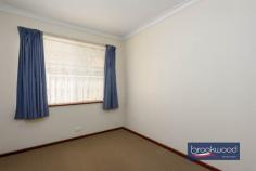 24 Bellevue Rd Bellevue WA 6056 $725,000 This solid 1975 brick-and-tile home sits on a generous 680-square-metre block zoned R20/40, offering immediate liveability with genuine potential for those who see beyond the mauve bathroom tiles. The bones are good, the layout works, and there’s space to move – both inside and out. A powered workshop, substantial verandah, and private backyard complete a package that rewards practical thinking. 4 bedrooms, 1 bathroom 1975-built brick and tile Well-proportioned living Open-plan kitchen meals 6 m x 6 m powered shed Private fenced backyard 16 m x 3 m rear verandah Drive through BY access Zoned R20/40, 680 sqm lot 15 minutes to Perth airport The formal entry from the tandem carport leads through an arched doorway into an air-conditioned lounge room that’s surprisingly light and well-proportioned. Timber-look floors underfoot and a picture window overlooking the backyard create an airy feel that belies the home’s modest street presence. The open-plan kitchen and meals area continue the functional approach. Timber-look cabinetry, laminated benchtops, and an integrated breakfast bar define the cooking zone, which is fitted with an electric oven, new dishwasher, never used and a built-in pantry. Nothing revolutionary, but everything you need is here and sensibly arranged. The meals area accommodates a proper dining table with room to move, and the outlook to the backyard makes morning coffee feel less rushed than it probably is. Four carpeted bedrooms branch off a central hallway in classic 70s fashion. The main bedroom comes with air-conditioning, a ceiling fan, and a wardrobe, providing a comfortable retreat. One of the junior rooms includes a robe recess. The shared family bathroom embraces its era with mauve fixtures and tiles that someone, somewhere, is now paying premium prices to recreate. A separate WC sits off the walk-through laundry, a practical arrangement that eliminates morning bathroom queues. The backyard is where this property distinguishes itself. Double gates at the rear of the tandem carport provide drive-through access to a 6-metre by 6-metre powered workshop tucked into one corner – a space serious enough for projects, storage, or tinkering. A row of trimmed fiddlewood trees lines the rear boundary, their canopies creating a green screen that erupts with fragrant flowers come spring. The fully fenced lawn extends from an 16-metre verandah running the full width of the home’s rear, providing multiple zones for outdoor living. Palm trees frame a partially enclosed gazebo that previously housed a spa but reads more readily as an outdoor kitchen in waiting. Add a barbecue, some string lights, and comfortable seating, and you’ve created the kind of entertaining space that keeps people outside long after the sun sets. The privacy here is genuine – the kind where neighbours exist but don’t dominate your sightlines. The R20/40 zoning adds another dimension to the proposition. For those who see this as a long-term hold, there’s development potential. For those who want space now, the 680-square-metre block delivers elbow room. The location offers practical advantages too – Perth Airport sits roughly 15 minutes away via direct highway access, making early flights less punishing than they might be from elsewhere. This isn’t a home that will seduce you with European appliances or Instagram-ready interiors. It’s a solid, honest property that works now and offers options for later. The reward here is space – to live, to work, to potentially develop – at a point where space itself has become a luxury. For buyers who value function over fashion and see potential where others see only bathrooms that time forgot, this represents genuine opportunity.